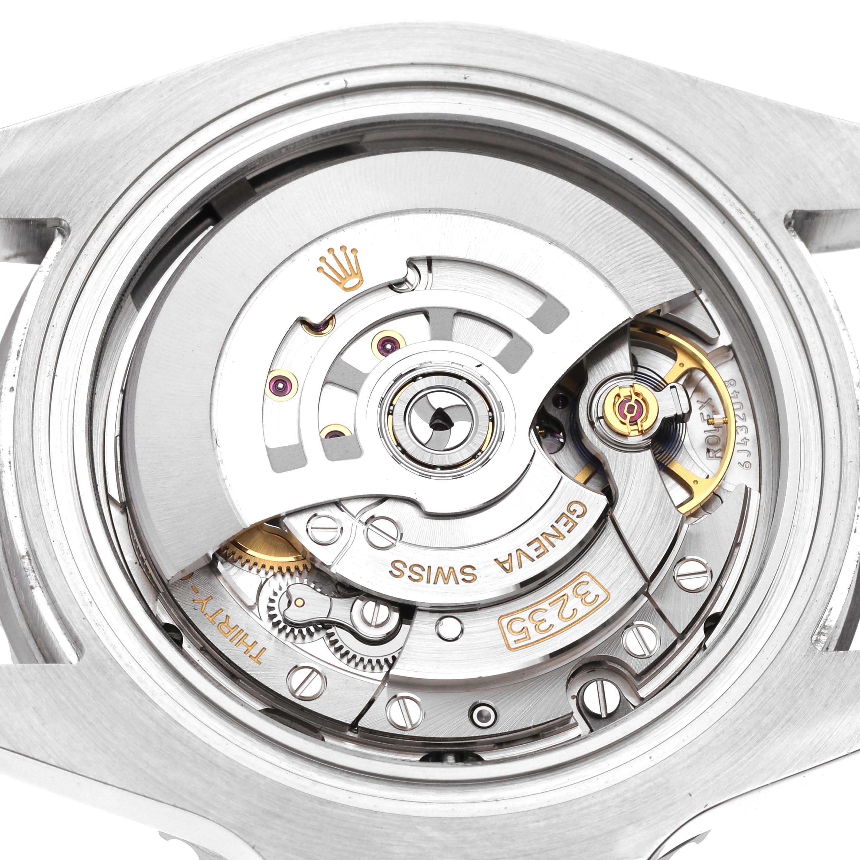 The image shows the movement of a Rolex Submariner 126610 Men's Stainless Steel Black Dial, viewed from the back, highlighting the inner mechanical components.