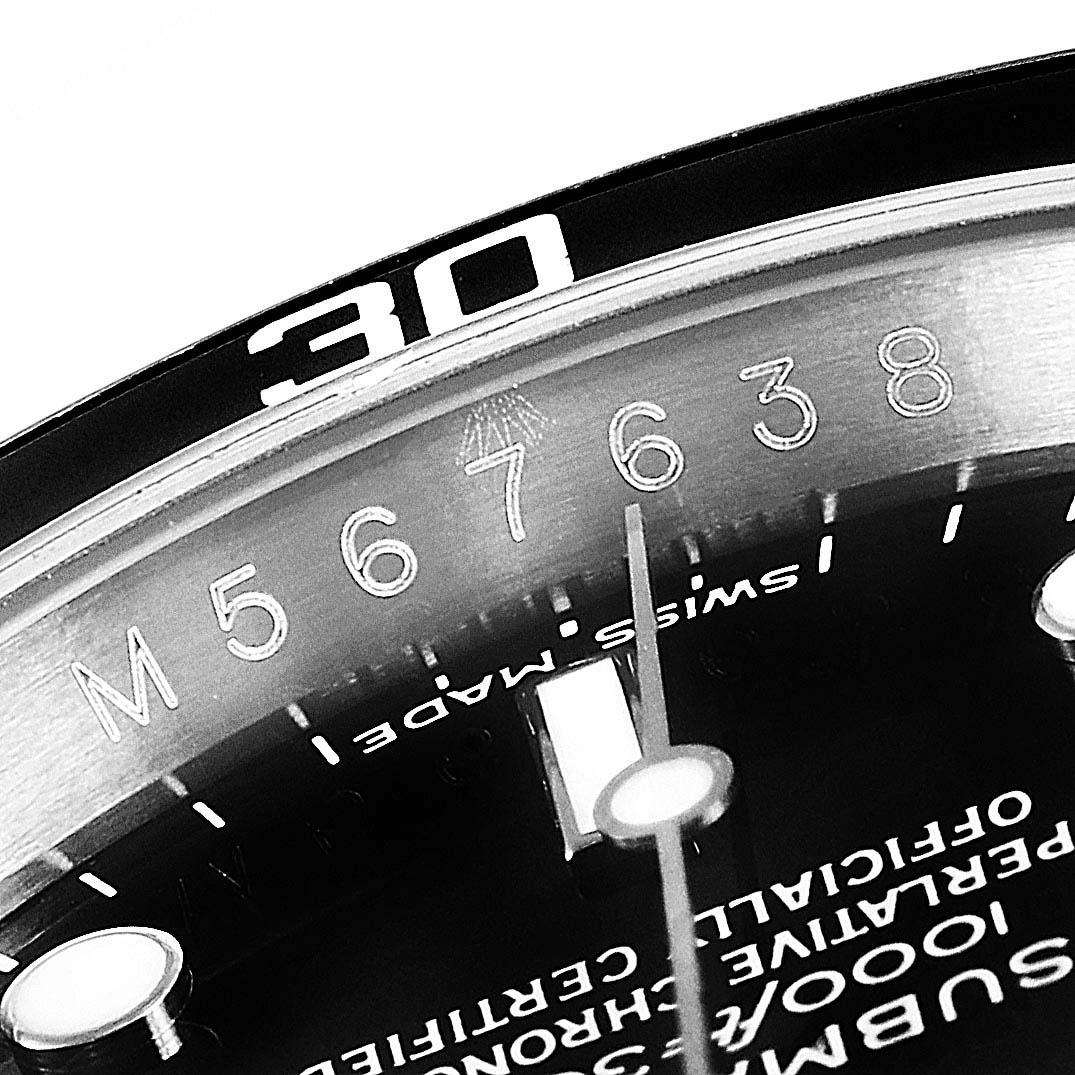 This close-up image of a Rolex Submariner 16610 Men
s Stainless Steel Black Dial 16610 Men
s Stainless Steel Black Dial watch shows the dial, bezel with the "30" marker, and part of the numerals.