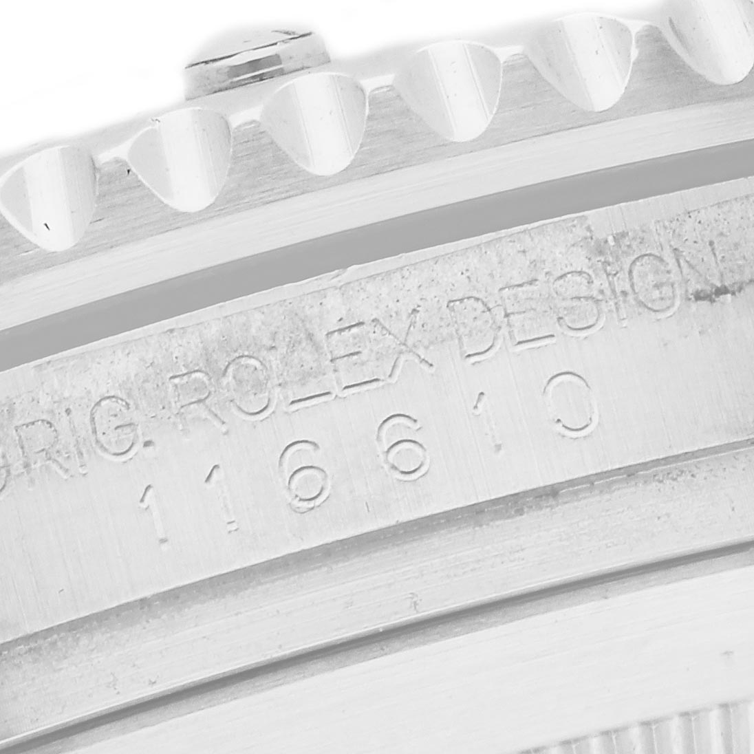 The image shows a close-up of the bezel and case side of a Rolex Submariner 116610 Men
s Stainless Steel Green Dial 116610 Men
s Stainless Steel Green Dial, highlighting the branding and model number engraving.