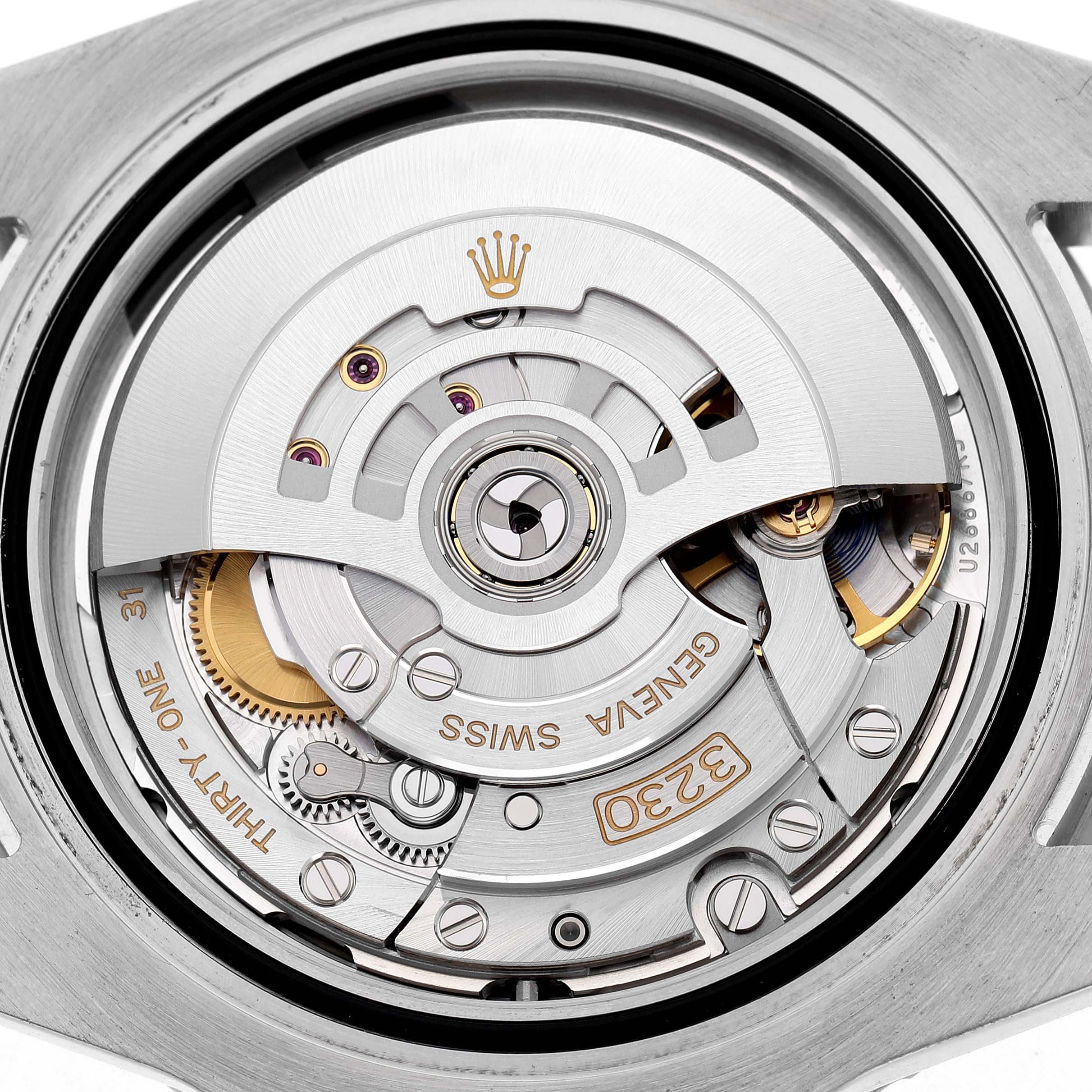The image shows a close-up of the Rolex Submariner 124060 Men's Stainless Steel Black Dial's movement from the back, highlighting the rotor and intricate components.