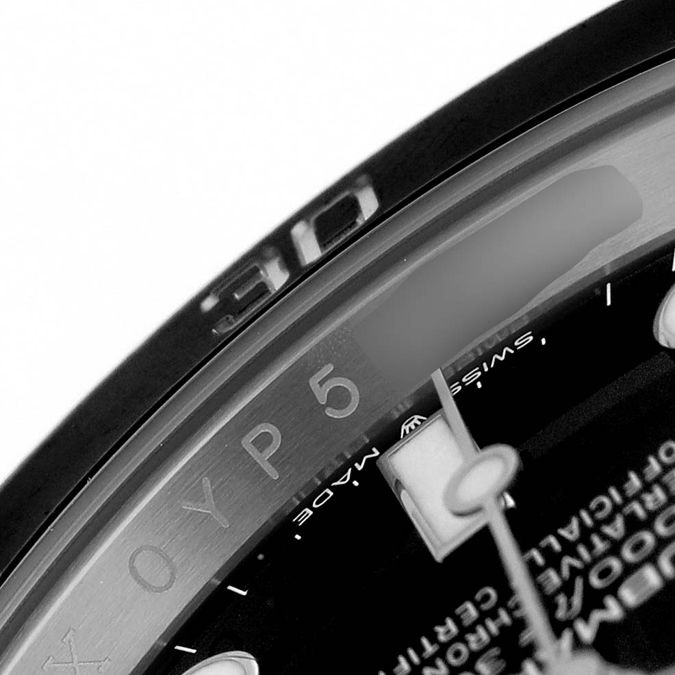 The image shows a close-up angle of the bezel, inner dial edge, and part of the hour hand of a Rolex Submariner 124060 Men's Stainless Steel Black Dial watch.