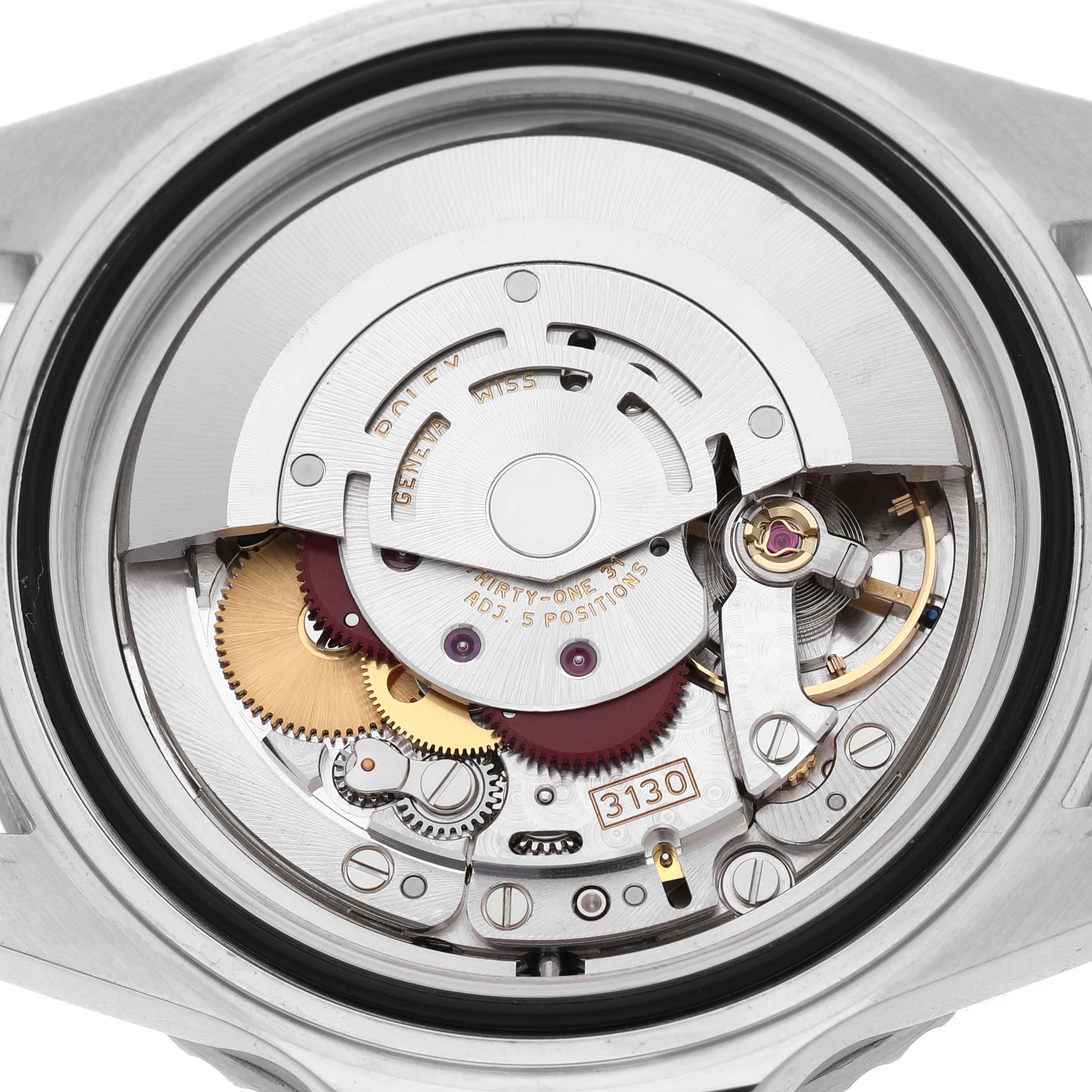 The image shows the inner movement of a Rolex Submariner 14060M Men's Stainless Steel Black Dial, displaying gears and components from the case back angle.