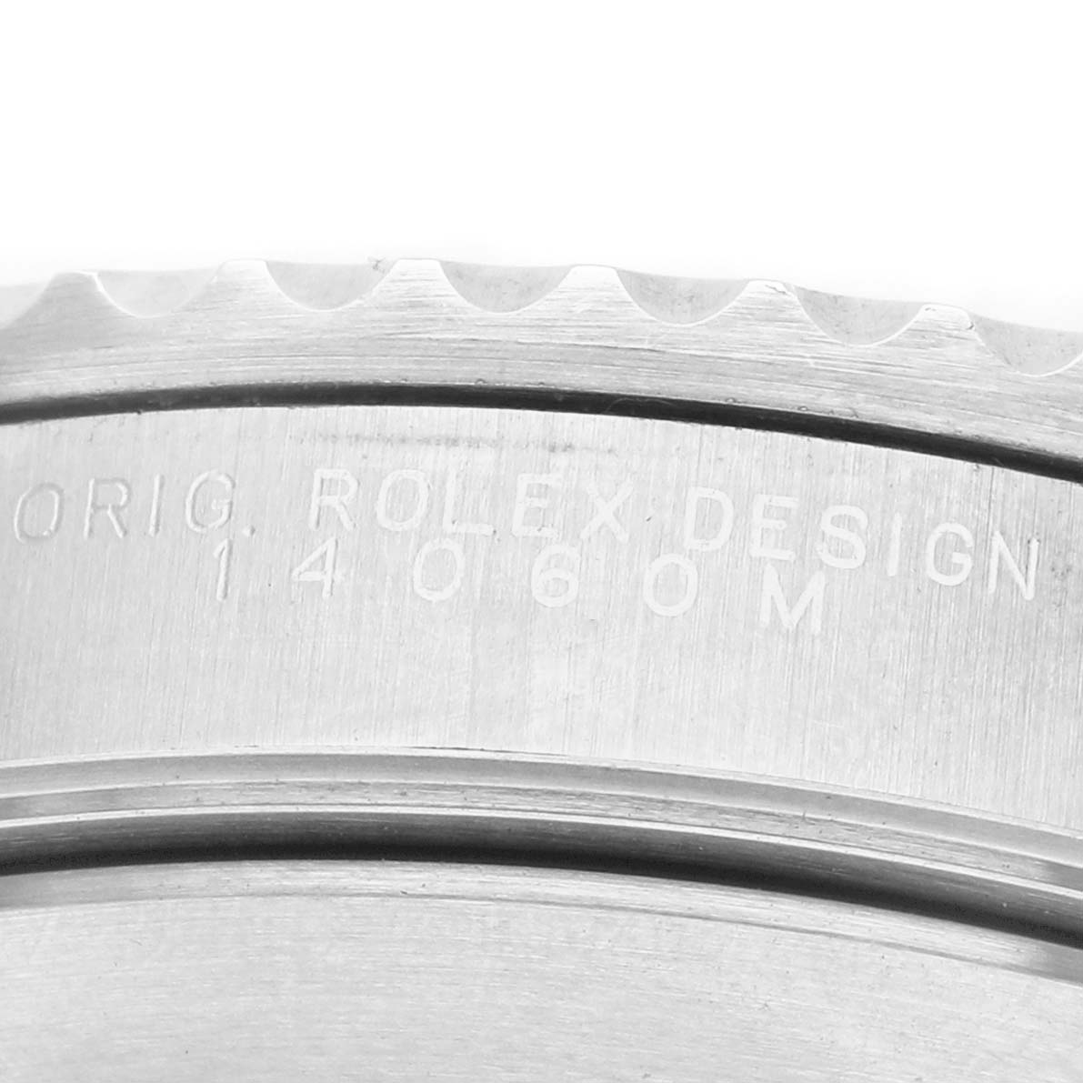The image shows a close-up of the engraved case side of a Rolex Submariner 14060M Men's Stainless Steel Black Dial, highlighting the text and part of the bezel.