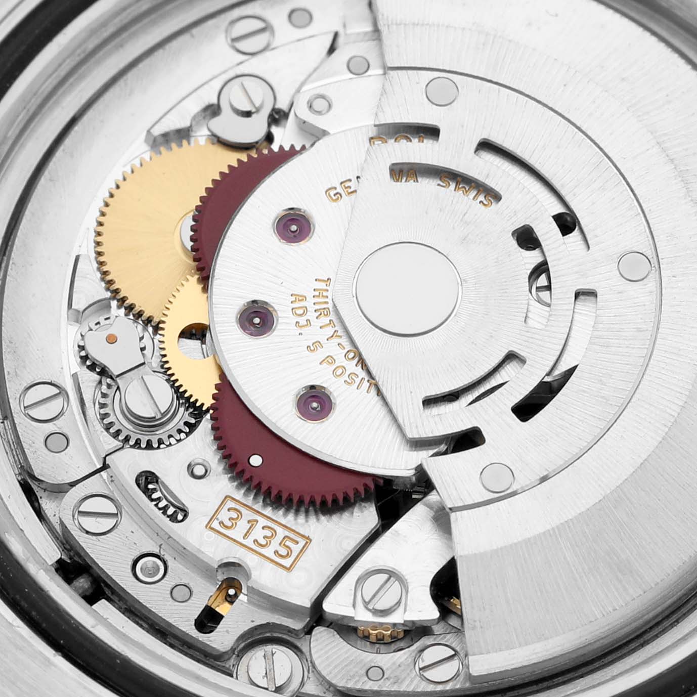 This is a close-up view of the movement mechanism inside a Rolex Submariner 116613LB Men's Steel and Gold (two tone) Blue Dial 116613LB Men's Steel and Gold (two tone) Blue Dial, showing gears, screws, and the automatic rotor.
