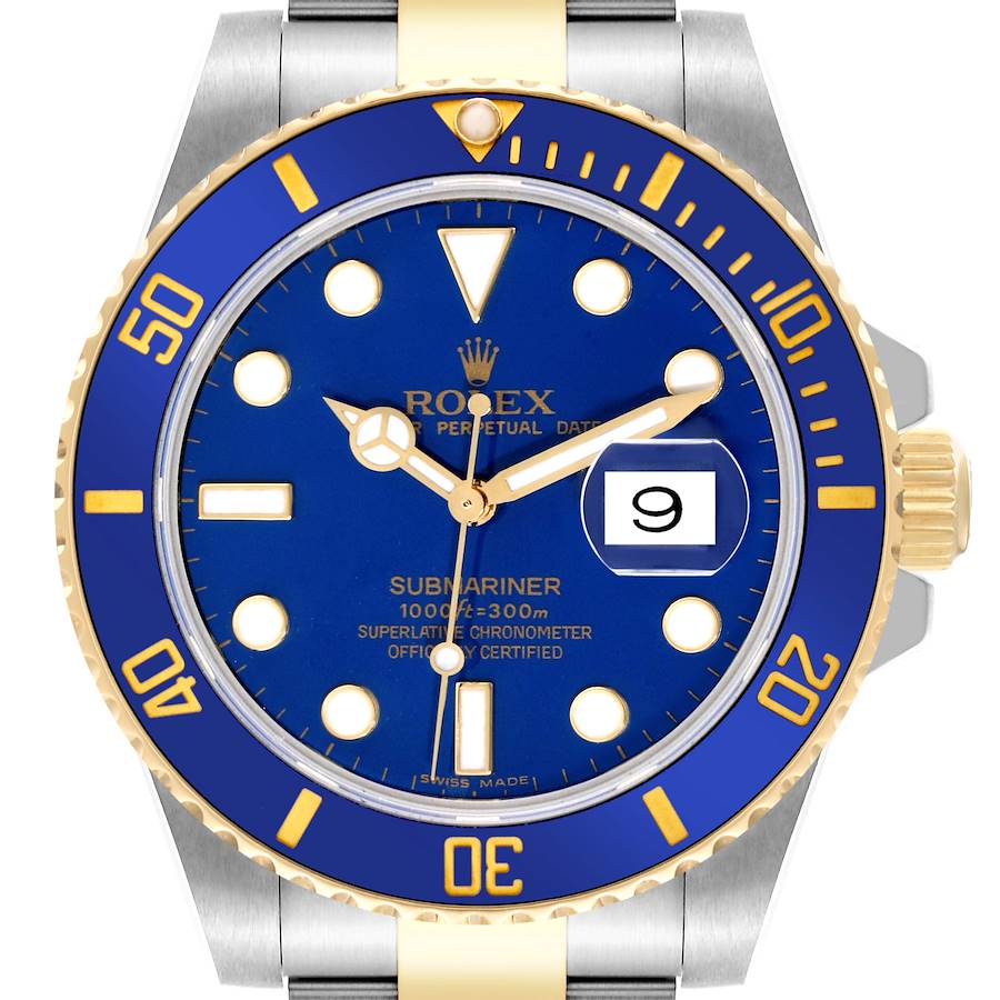 The image shows the front view of a Rolex Submariner watch, featuring a blue and gold dial with a date window and luminescent markers.