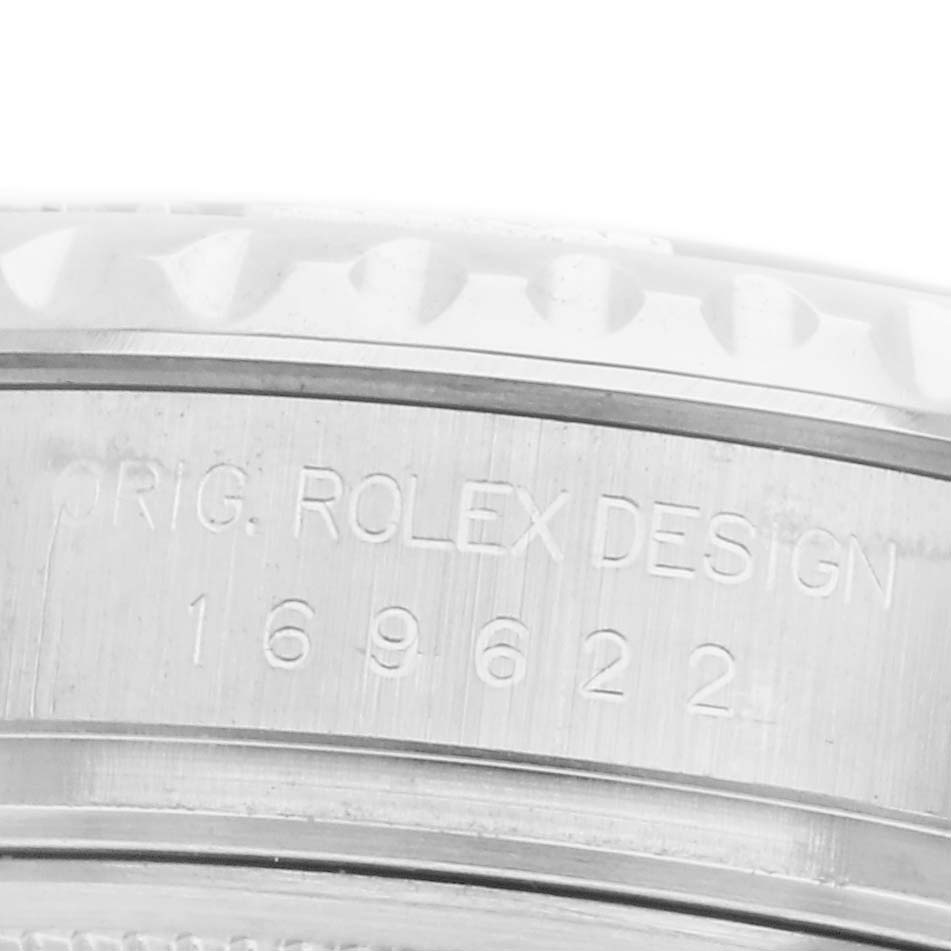 The image shows a close-up of the case side of a Rolex Yacht-Master 169622 Women
s Platinum Silver Dial 169622 Women
s Platinum Silver Dial, highlighting the engraved design number.