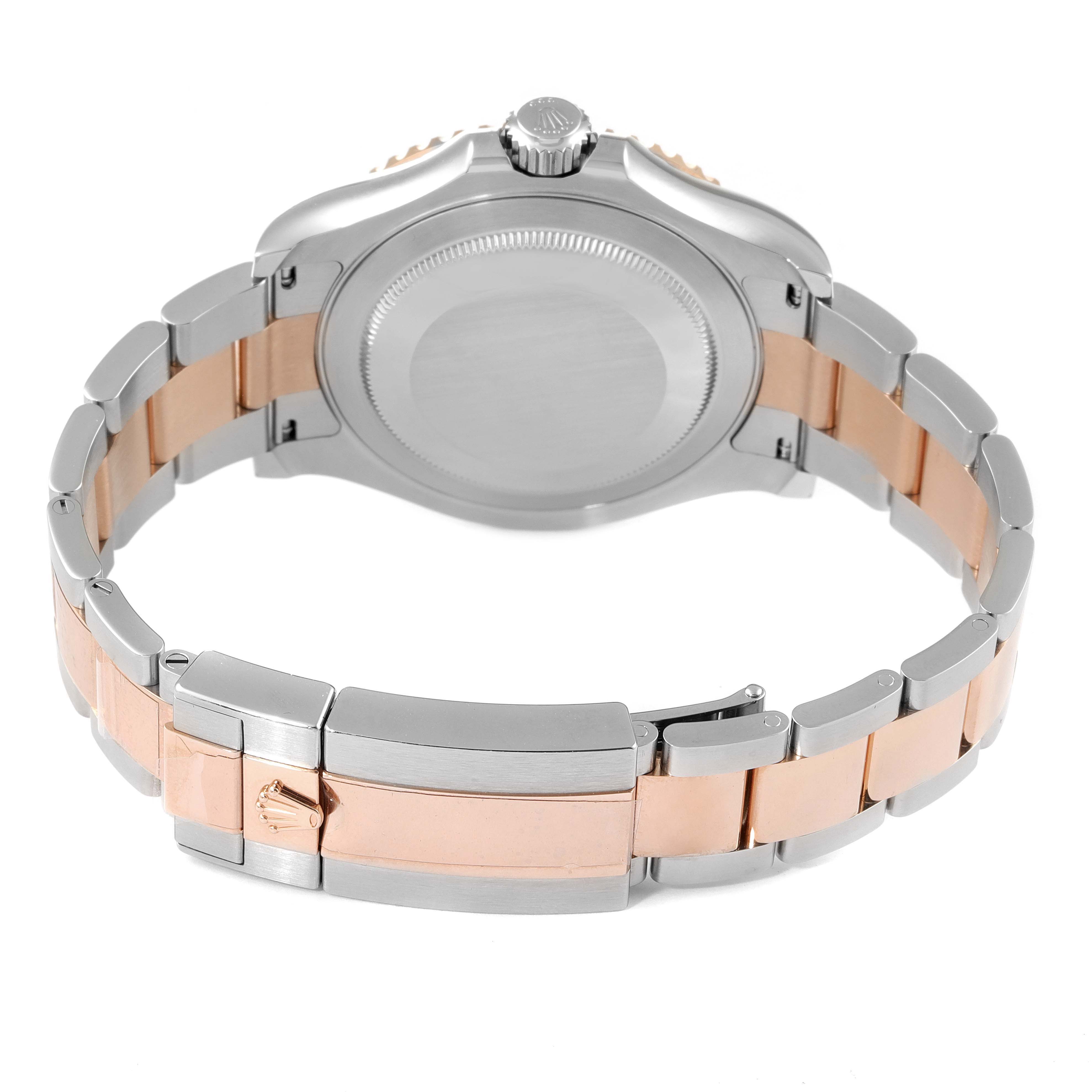 The image shows the back of a Rolex Yacht-Master 126621 Men
s Steel and Gold (two tone) Black Dial 126621 Men
s Steel and Gold (two tone) Black Dial watch, focusing on the bracelet, clasp, and case back.