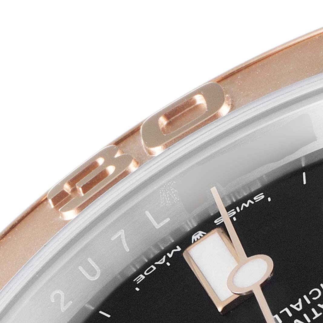 This close-up image shows the bezel and part of the face of the Rolex Yacht-Master 126621 Men
s Steel and Gold (two tone) Black Dial 126621 Men
s Steel and Gold (two tone) Black Dial watch.