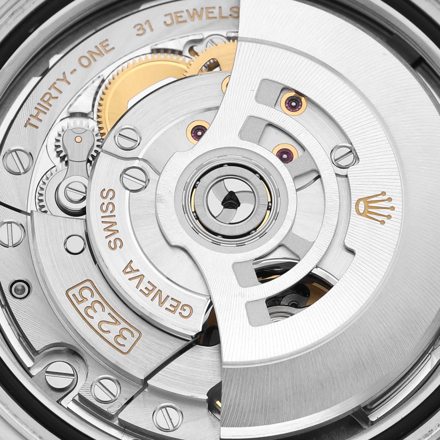 The image shows a close-up of the movement mechanism of a Rolex Yacht-Master 126621 Men
s Steel and Gold (two tone) Black Dial 126621 Men
s Steel and Gold (two tone) Black Dial watch, highlighting the intricate gears and rotor.