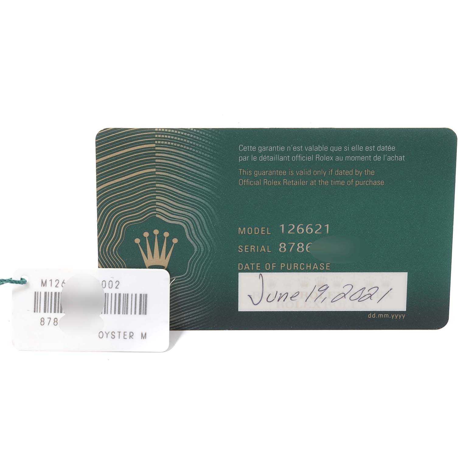The image shows the warranty card and a tag with the model and serial numbers for a Rolex Yacht-Master 126621 Men
s Steel and Gold (two tone) Black Dial 126621 Men
s Steel and Gold (two tone) Black Dial watch.