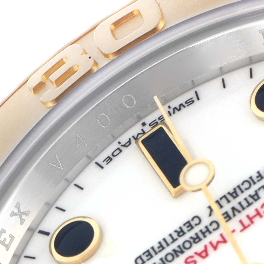 The image shows a close-up of the Rolex Yacht-Master 16623 Men
s Steel and Gold (two tone) White Dial 16623 Men
s Steel and Gold (two tone) White Dial
s bezel, dial, and part of the minute hand.