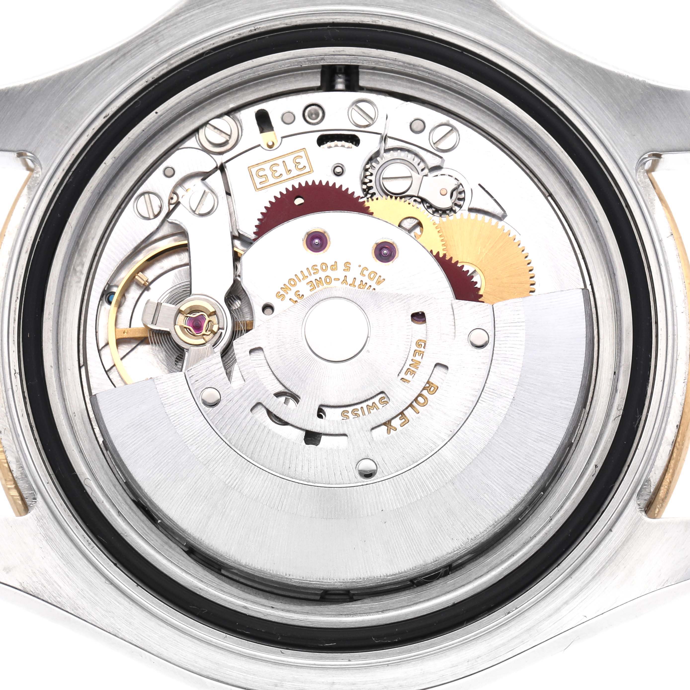 This is an inner view of a Rolex Yacht-Master 16623 Men
s Steel and Gold (two tone) White Dial 16623 Men
s Steel and Gold (two tone) White Dial, showing its intricate movement and gears from a rear angle.
