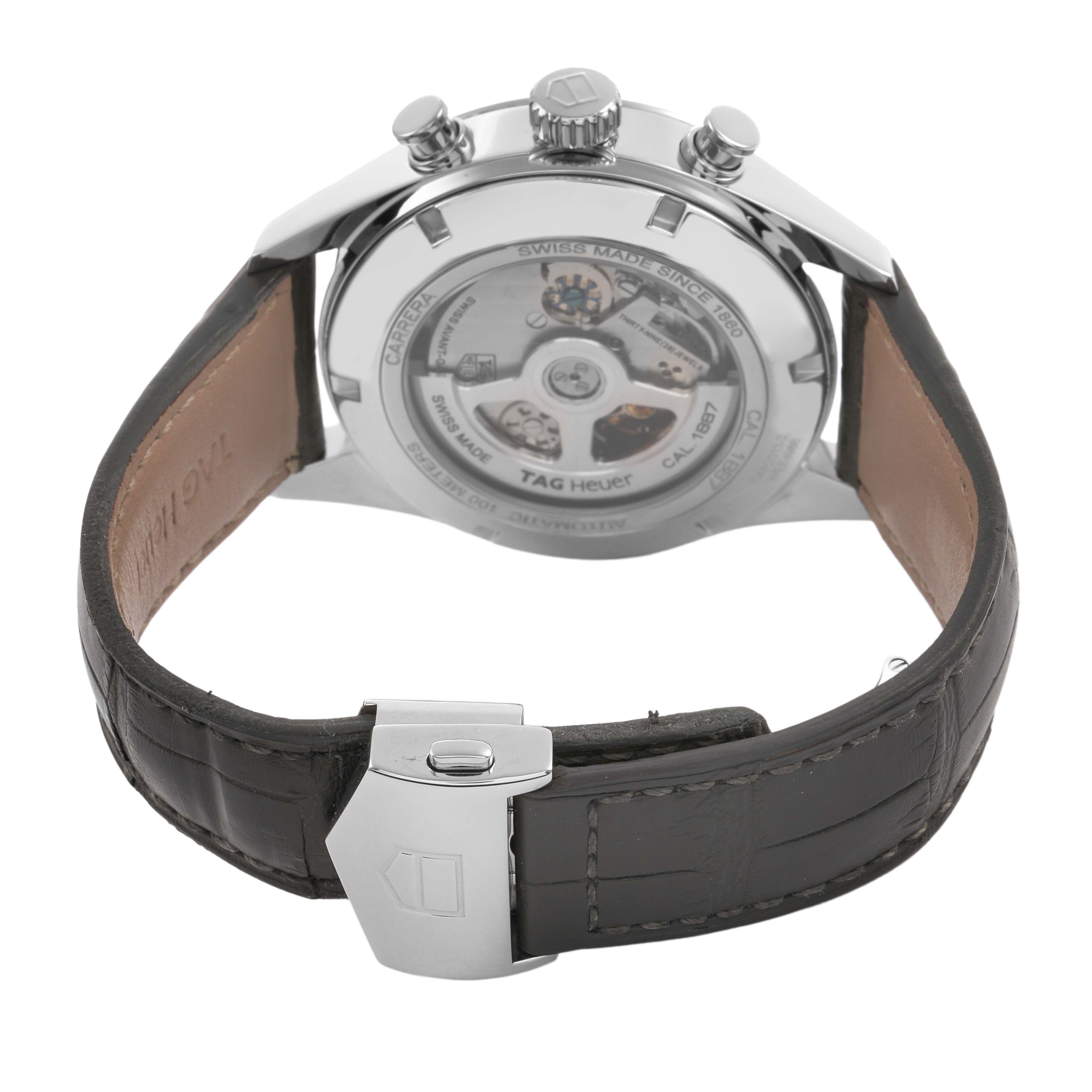 The image shows the back view of a TAG Heuer Carrera watch, highlighting the movement and deployment clasp.