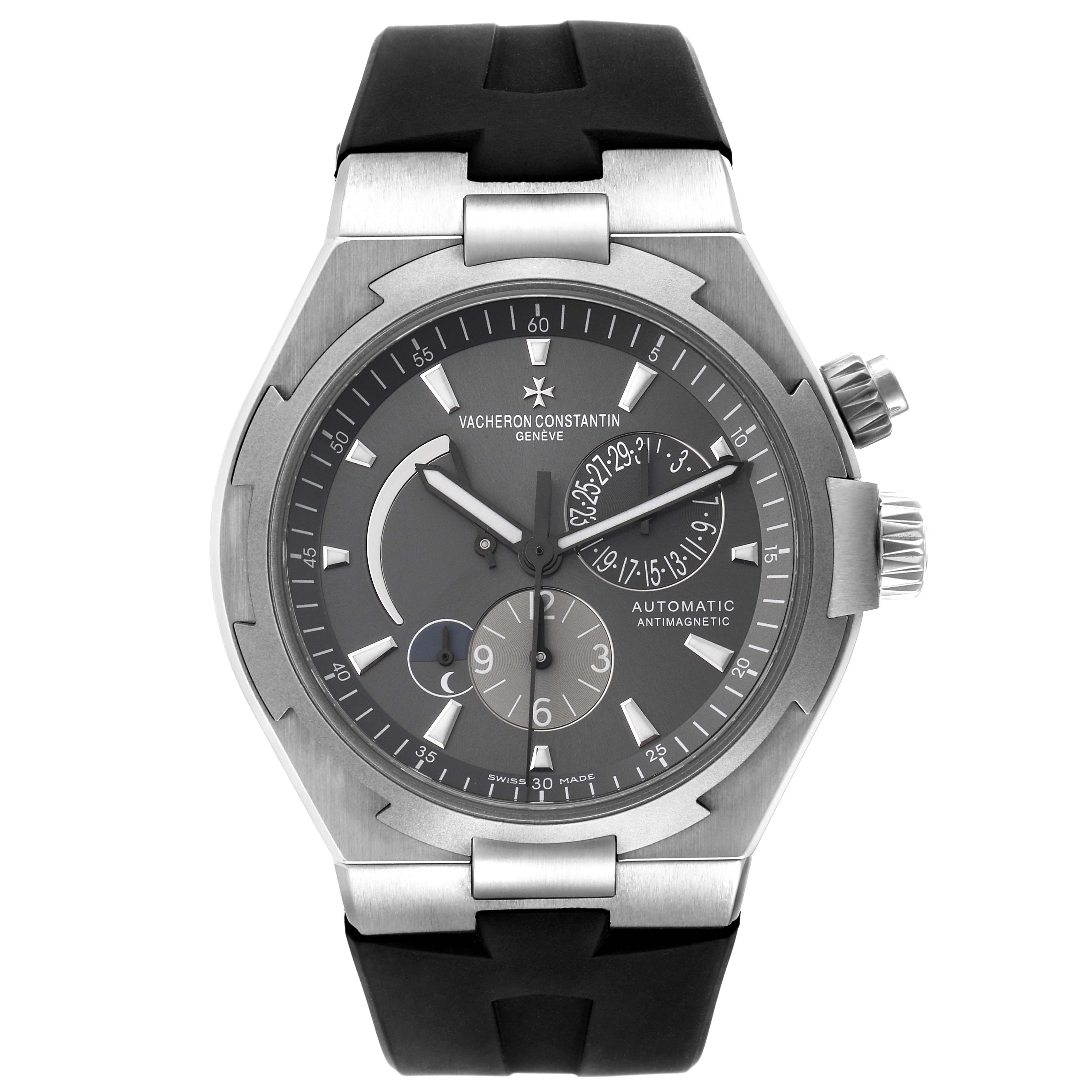The image shows a front view of the dial and bezel of the Vacheron Constantin Overseas 47450/000W-9511 Men
s Stainless Steel Black Dial 47450/000W-9511 Men
s Stainless Steel Black Dial watch with its strap visible.