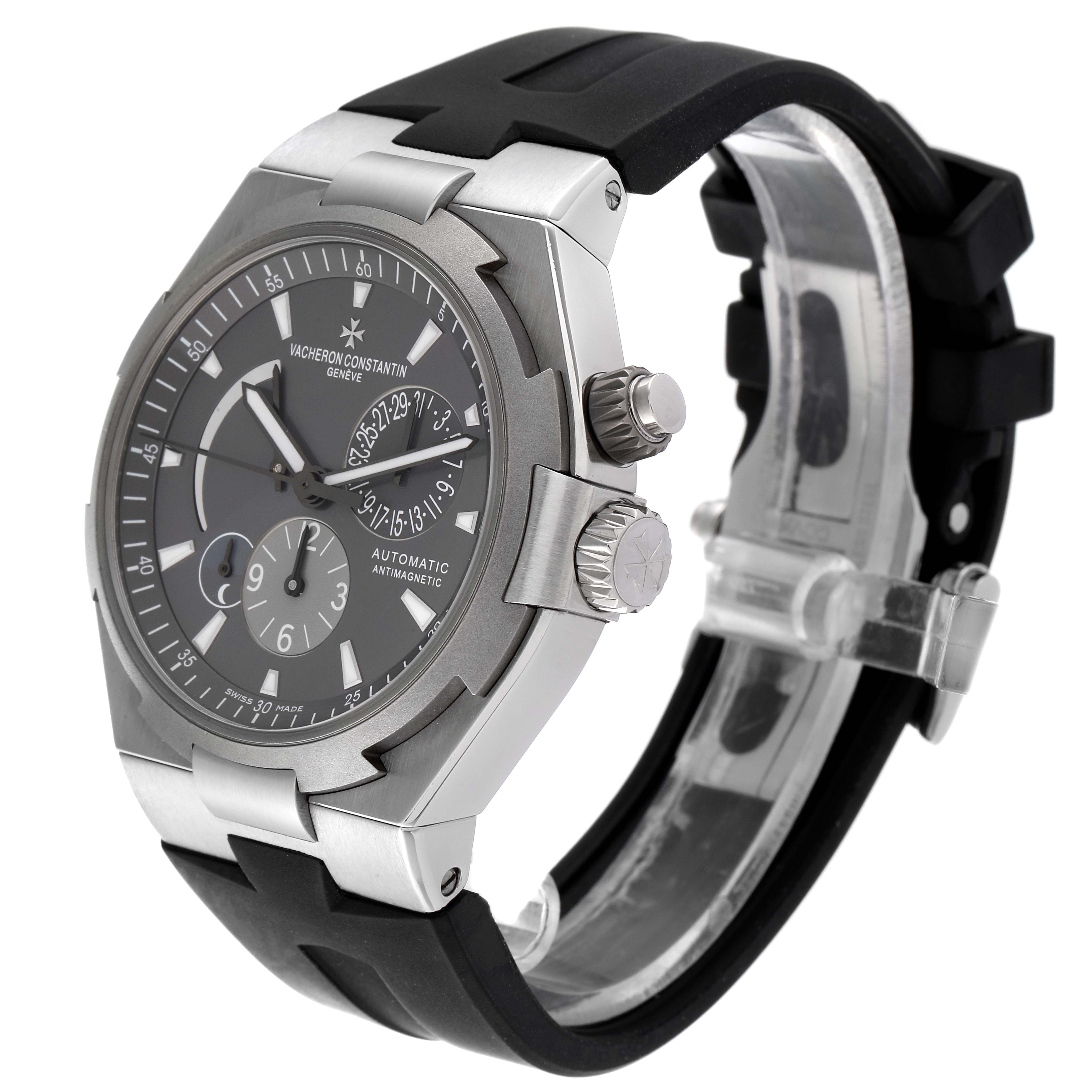 The image shows a side angle of the Vacheron Constantin Overseas 47450/000W-9511 Men
s Stainless Steel Black Dial 47450/000W-9511 Men
s Stainless Steel Black Dial model watch, highlighting its face, crown, and strap.