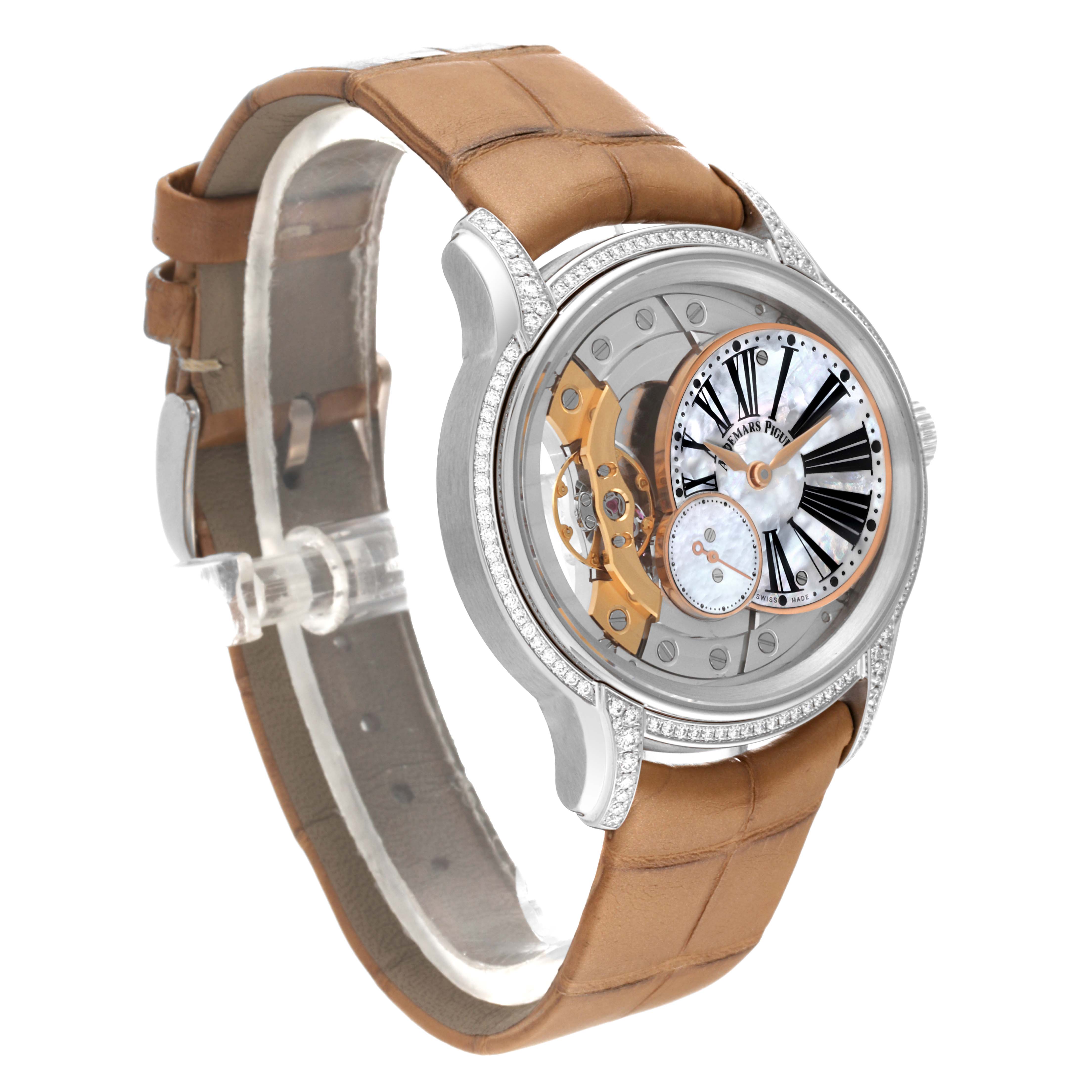 The Audemars Piguet Millenary 77247BC.ZZ.A813CR.01 Women's White Gold Mother of Pearl Dial 77247BC.ZZ.A813CR.01 Women's White Gold Mother of Pearl Dial watch is shown at a three-quarter angle, highlighting the dial, bezel, and brown strap.