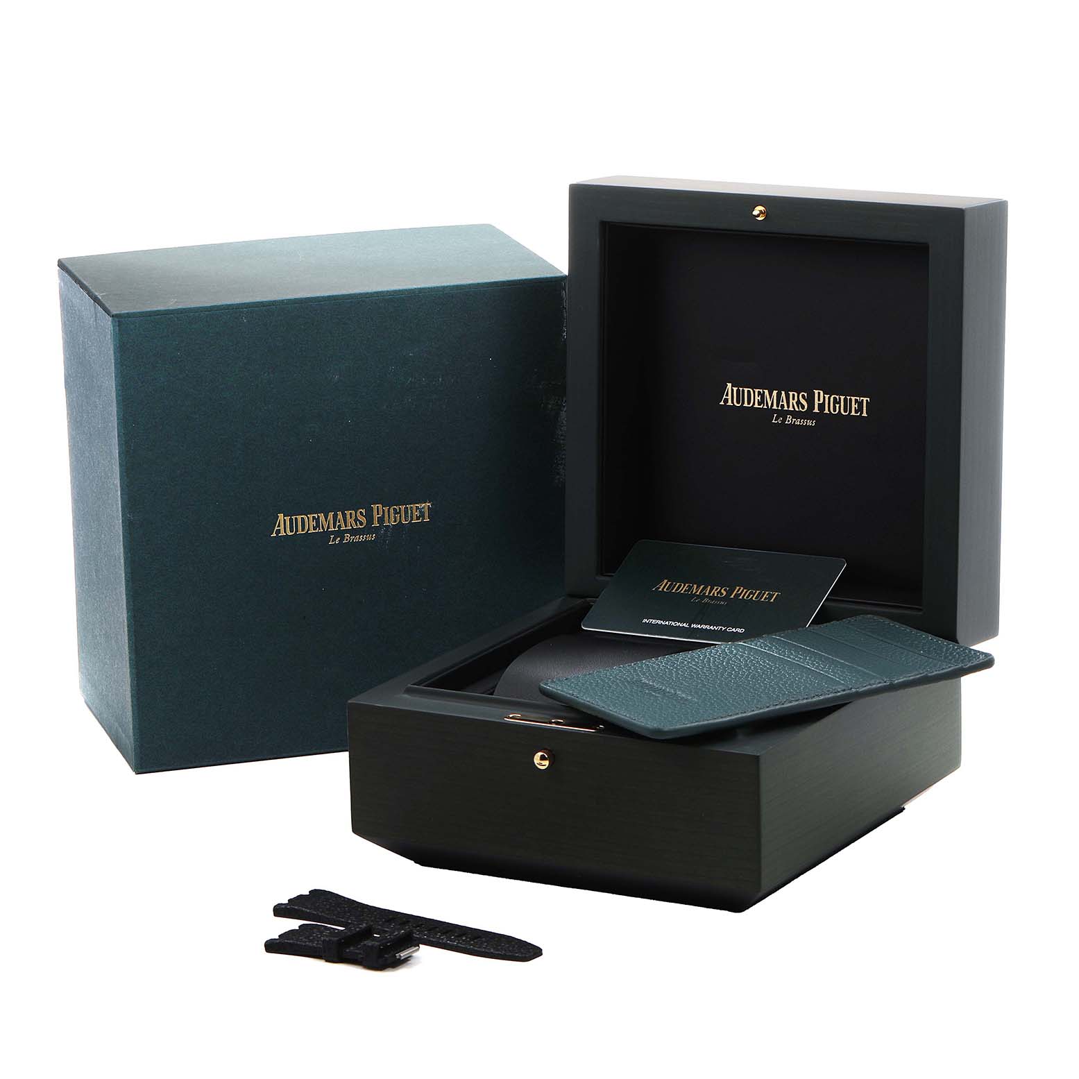 The image shows the packaging and accessories of the Audemars Piguet Royal Oak Offshore 77605OK Mens Rose Gold White Dial, including a box, cardholder, and strap.