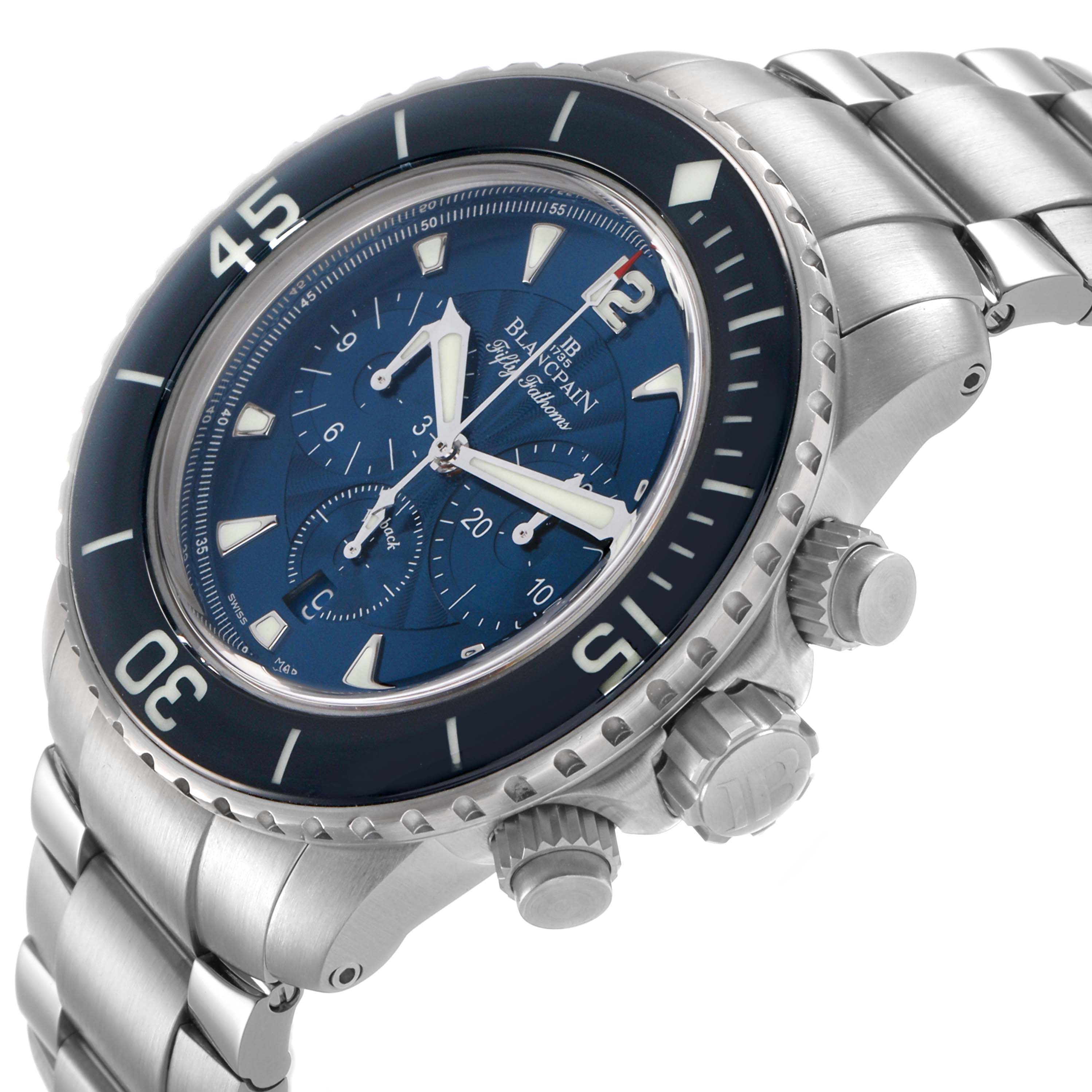 The Blancpain Fifty Fathoms 5085FB-1140-71B Men's Stainless Steel Blue Dial watch is shown at an angle highlighting the bezel, crown, pushers, and metal bracelet.