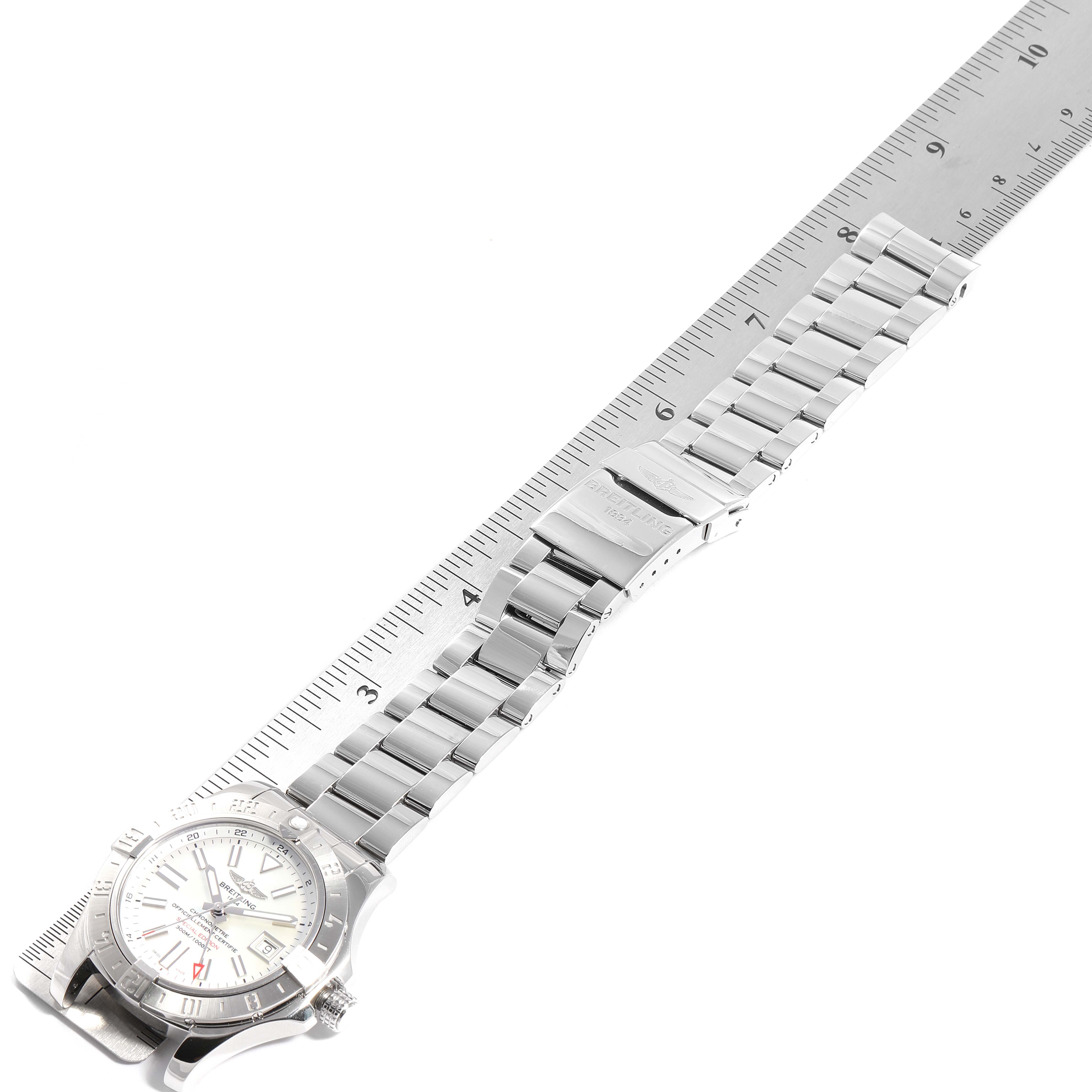 The image shows a Breitling Avenger A3239011-C872-170A  Men's Stainless Steel Mother of Pearl Dial A3239011-C872-170A  Men's Stainless Steel Mother of Pearl Dial watch horizontally placed alongside a measuring ruler, highlighting its band and dial.