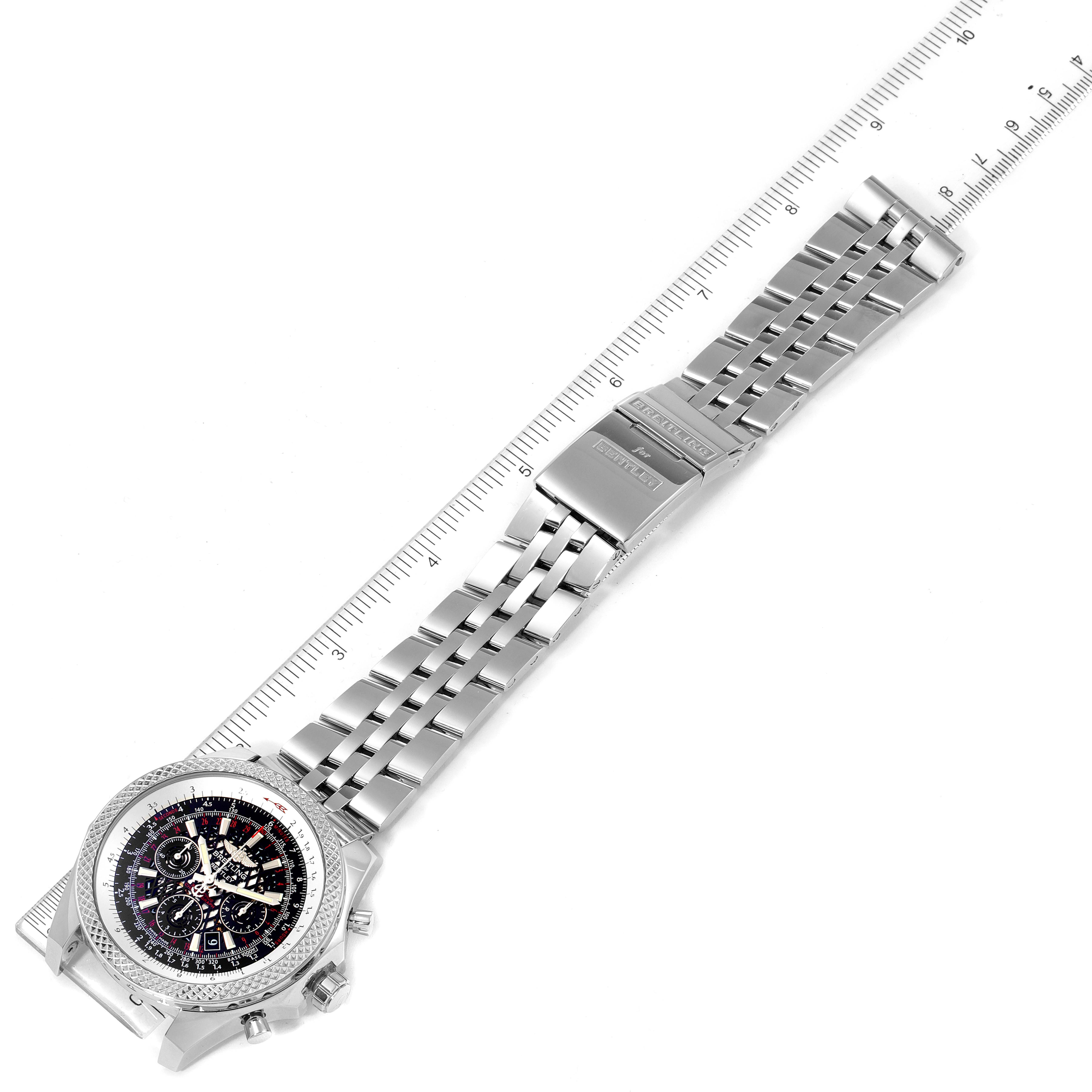 This image shows a Breitling Bentley AB061112.BD80.990A Men's Stainless Steel Black Dial AB061112.BD80.990A Men's Stainless Steel Black Dial watch laid flat with the face and metal strap clearly visible, next to a ruler.