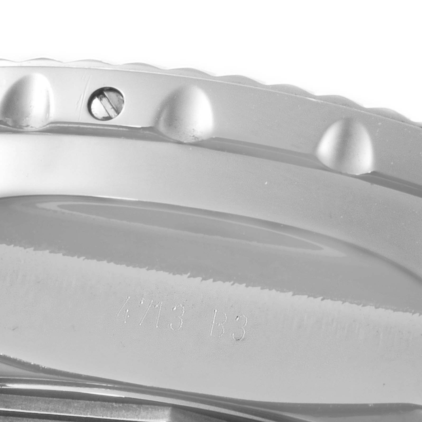 This close-up image shows the bezel and a portion of the casing with engraved text of a Breitling Bentley AB061112.BD80.990A Men's Stainless Steel Black Dial AB061112.BD80.990A Men's Stainless Steel Black Dial watch.