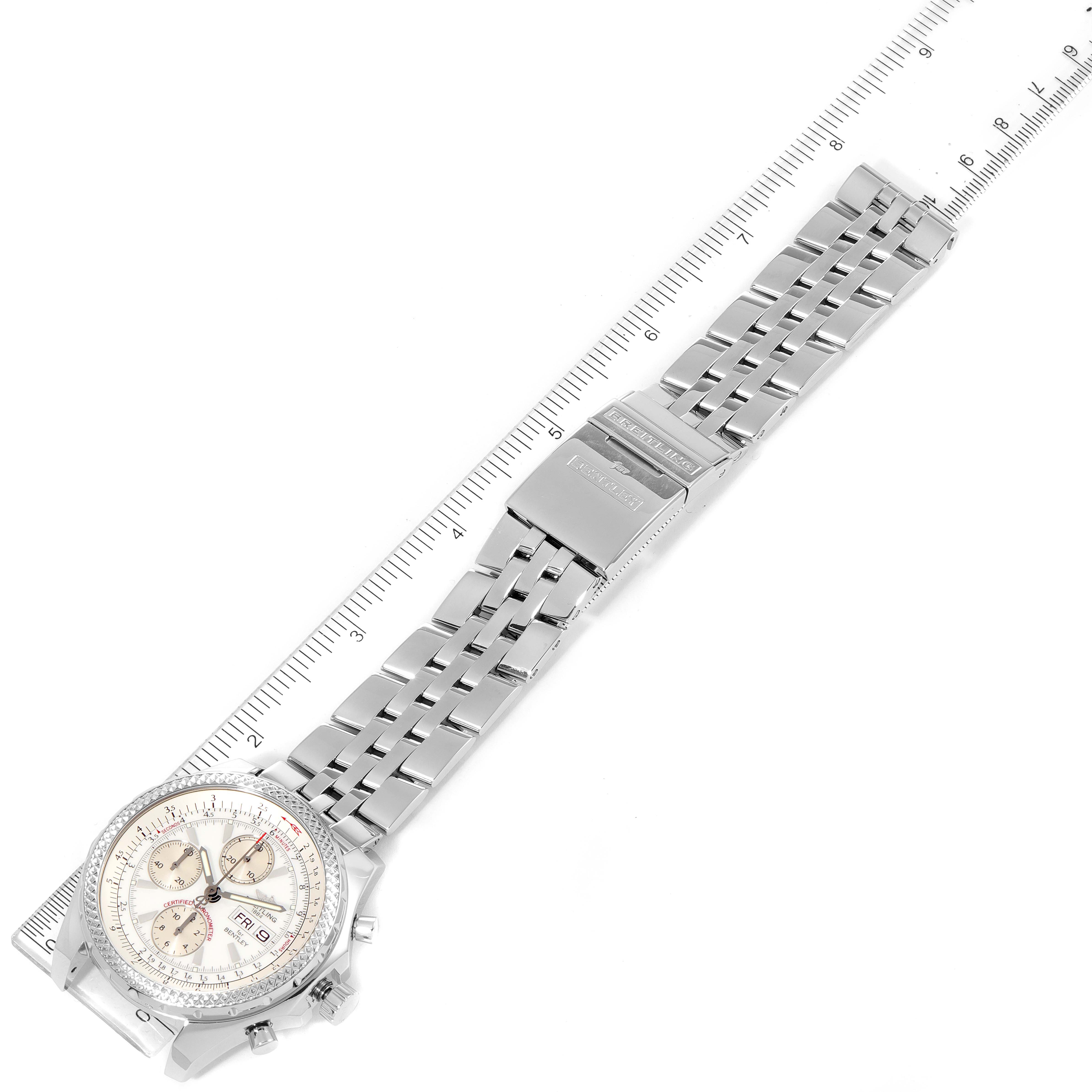 The image shows a top-down angle of a Breitling Bentley A13362 Men's Stainless Steel Silver Dial A13362 Men's Stainless Steel Silver Dial watch, highlighting its face and metal bracelet with a ruler for scale.