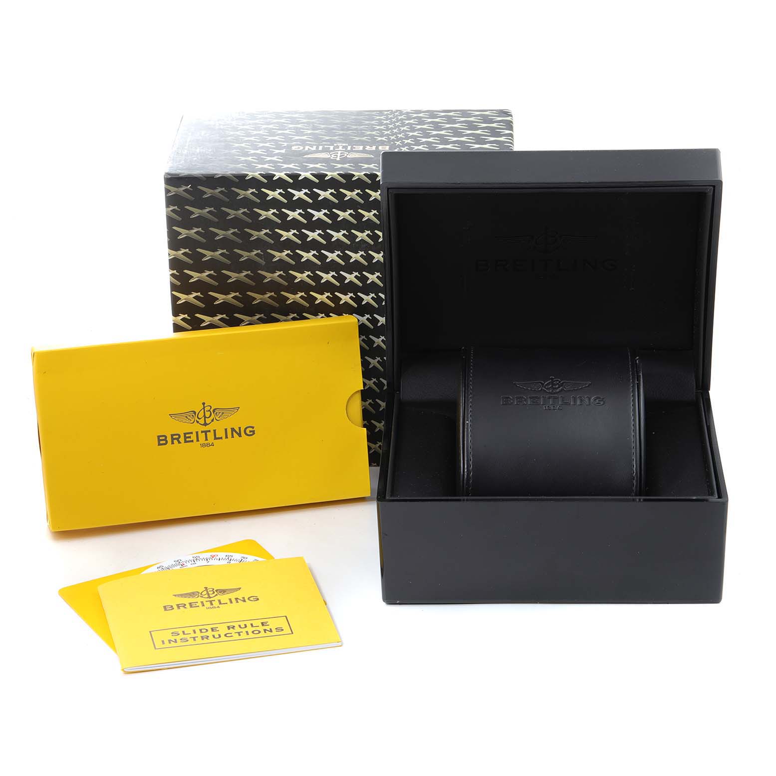 The image shows the Bentley model by Breitling's watch box, a yellow instruction booklet, and the outer packaging from a front angle.
