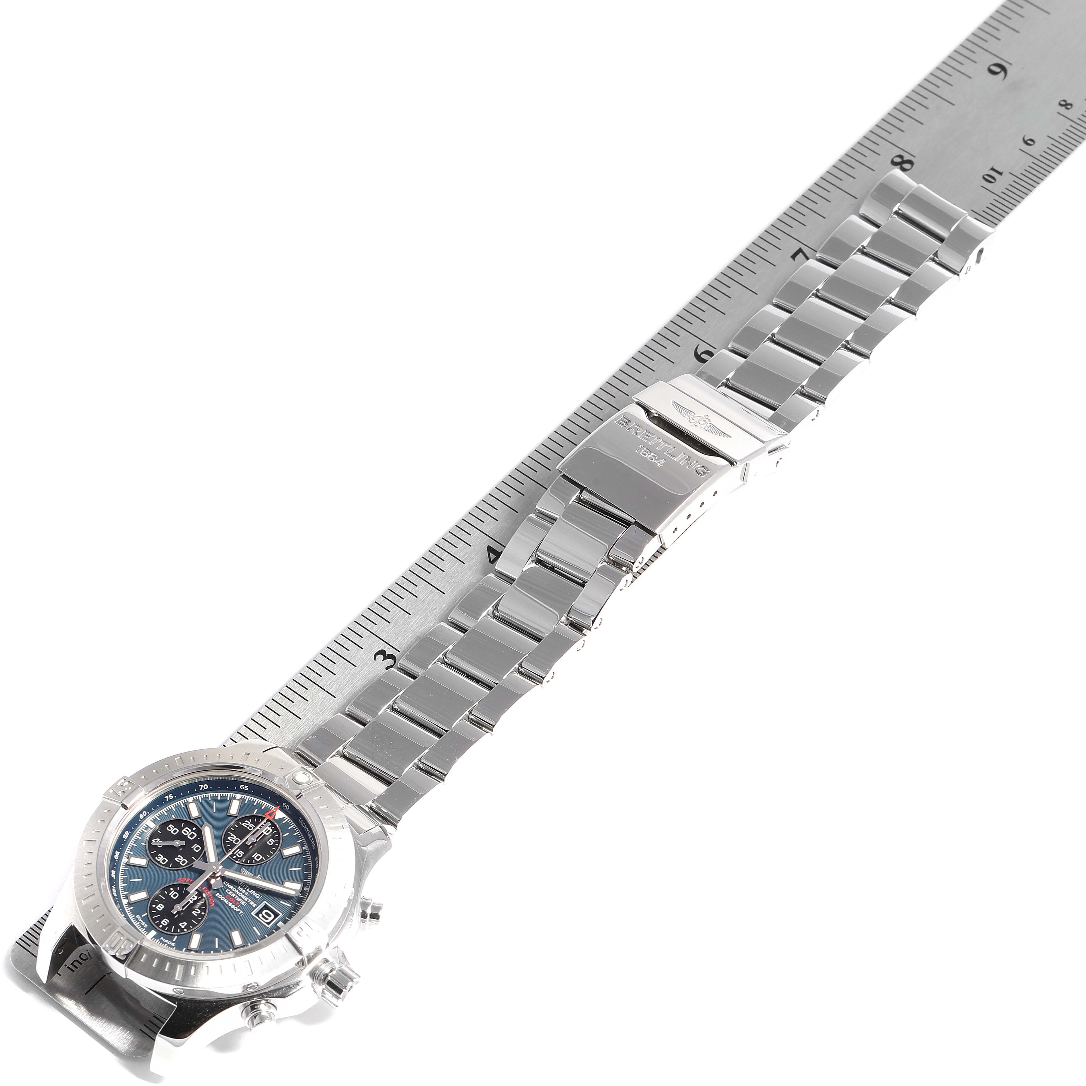The Breitling Colt A13035 Men's Stainless Steel Blue Dial A13035 Men's Stainless Steel Blue Dial watch is shown from a top-down angle, displaying the face, bracelet, and clasp beside a ruler for scale.