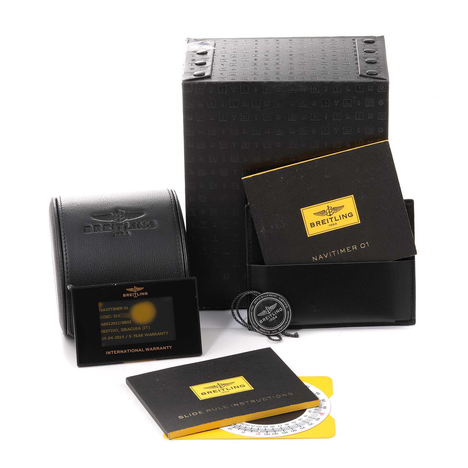 This image shows the packaging and accessories for a Breitling Navitimer AB0120 Men
s Stainless Steel Black Dial AB0120 Men
s Stainless Steel Black Dial watch, including manuals, warranty cards, and a carrying case.