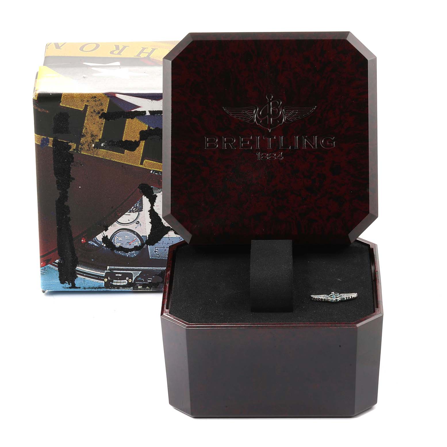 The image shows an open Breitling Navitimer A22322 Men's Stainless Steel Black Dial A22322 Men's Stainless Steel Black Dial watch box with no watch inside, only the emblem.