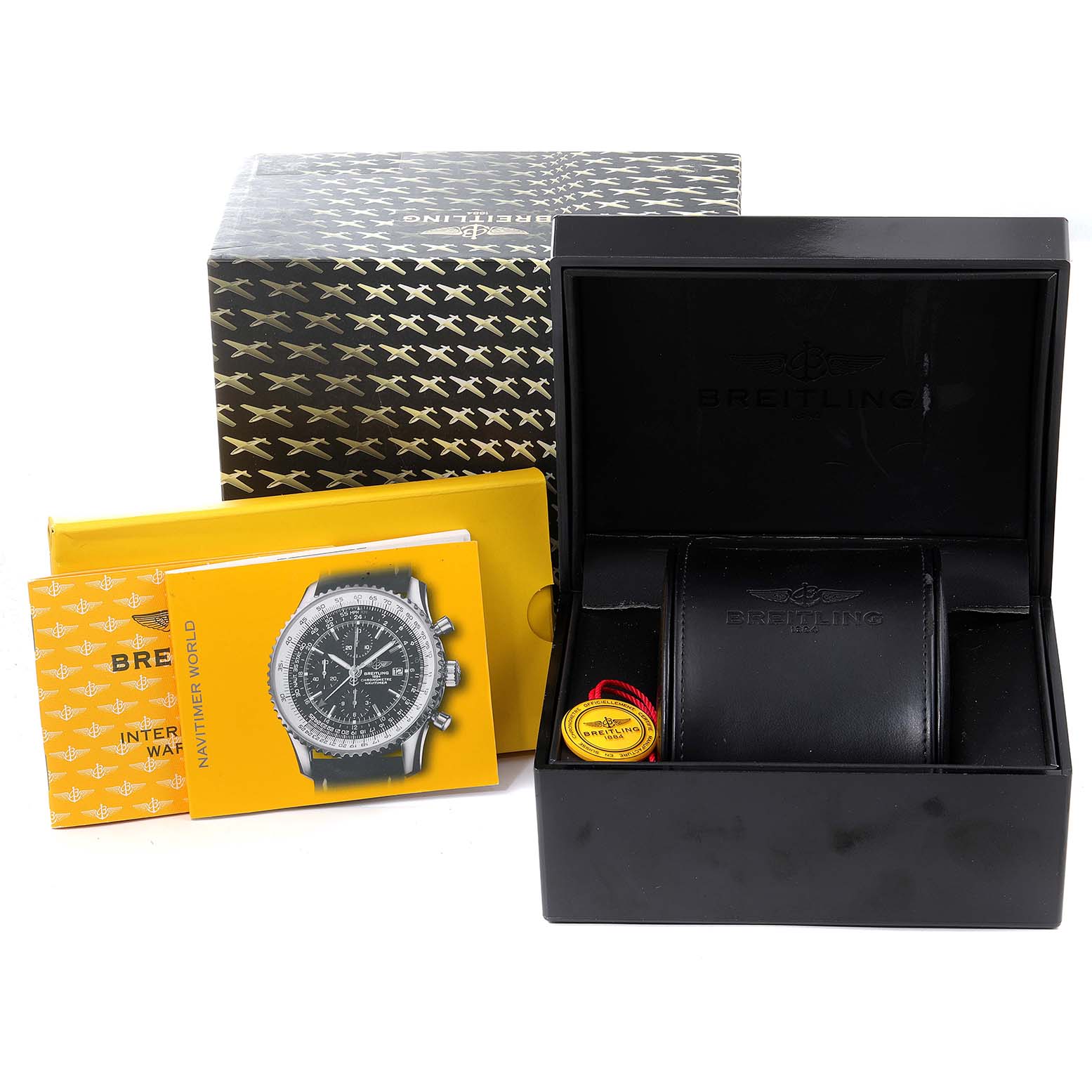 The image shows the box, case, manuals, and tag accessories for a Breitling Navitimer K24322 Men's Yellow Gold Black Dial K24322 Men's Yellow Gold Black Dial watch.