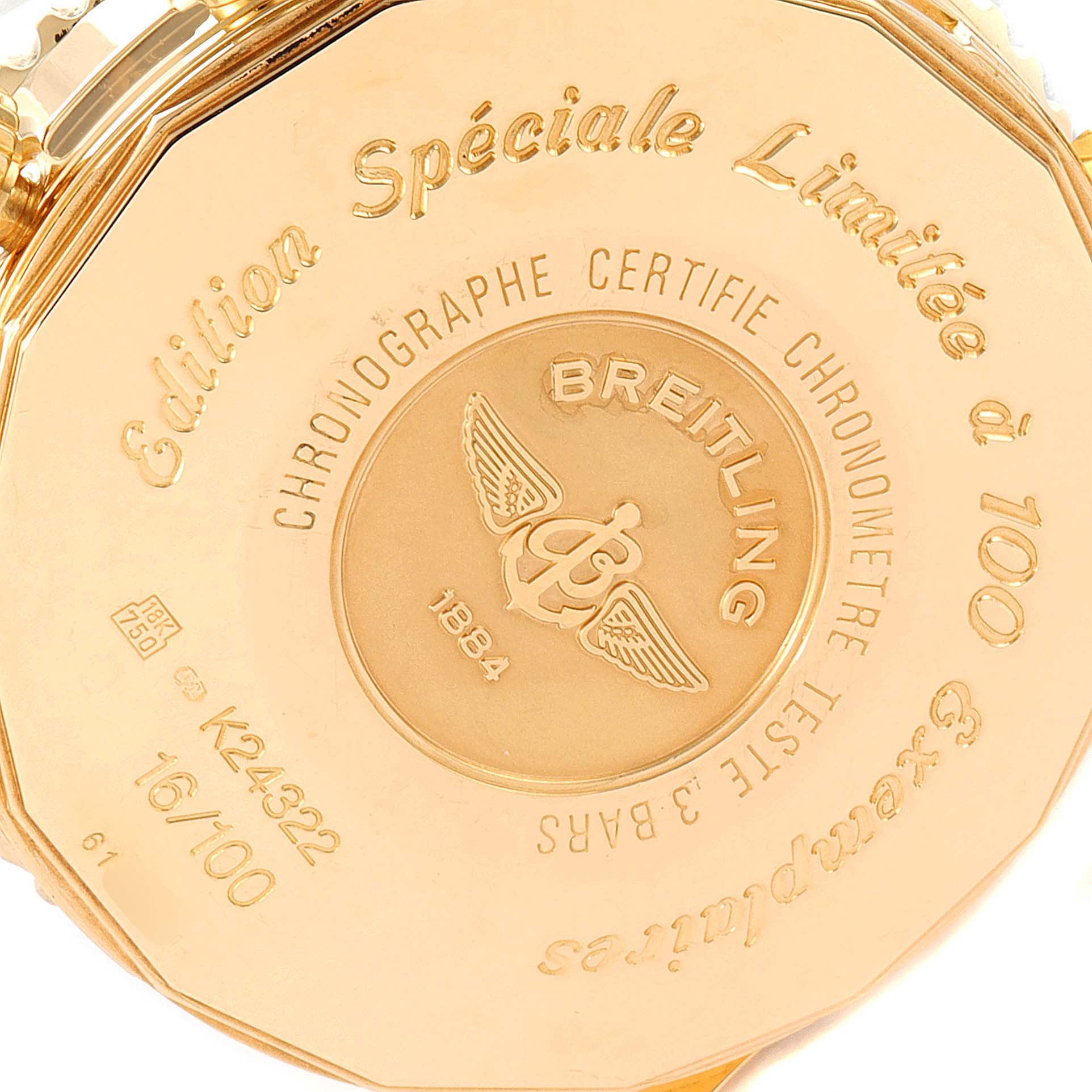 The image shows the back case of a limited edition Breitling Navitimer K24322 Men's Yellow Gold Black Dial K24322 Men's Yellow Gold Black Dial watch, highlighting its engravings and serial number.