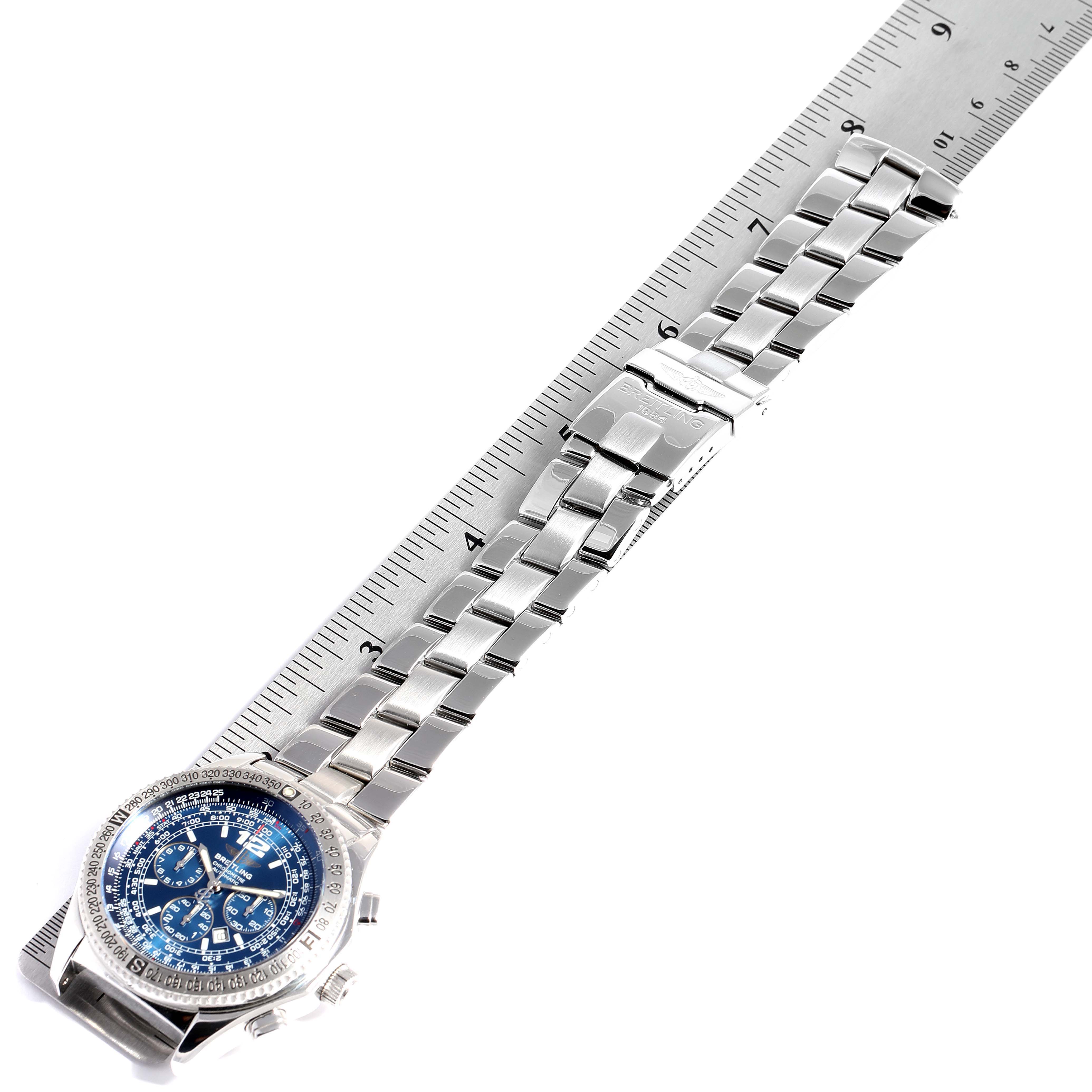 The image shows a top view of the Breitling Professional Series A42362 Men
s Stainless Steel Blue Dial A42362 Men
s Stainless Steel Blue Dial watch, highlighting its dial and stainless steel bracelet laid next to a ruler.