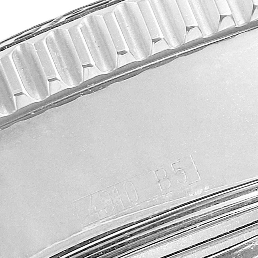The image shows a close-up of the bezel and part of the side of the Breitling Superocean A17364 Men's Stainless Steel Black Dial A17364 Men's Stainless Steel Black Dial watch with a serial number.