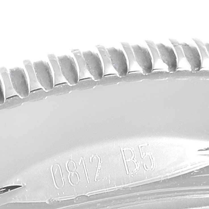 This close-up image shows part of the bezel and some engraved markings of a Breitling Superocean A17321 Men's Stainless Steel Black Dial A17321 Men's Stainless Steel Black Dial watch.