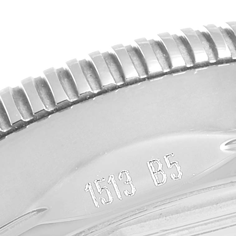The image shows a close-up of the bezel, detailing the ridged edge and engraved serial number on the Breitling Superocean A17321 Men's Stainless Steel Silver Dial A17321 Men's Stainless Steel Silver Dial watch.
