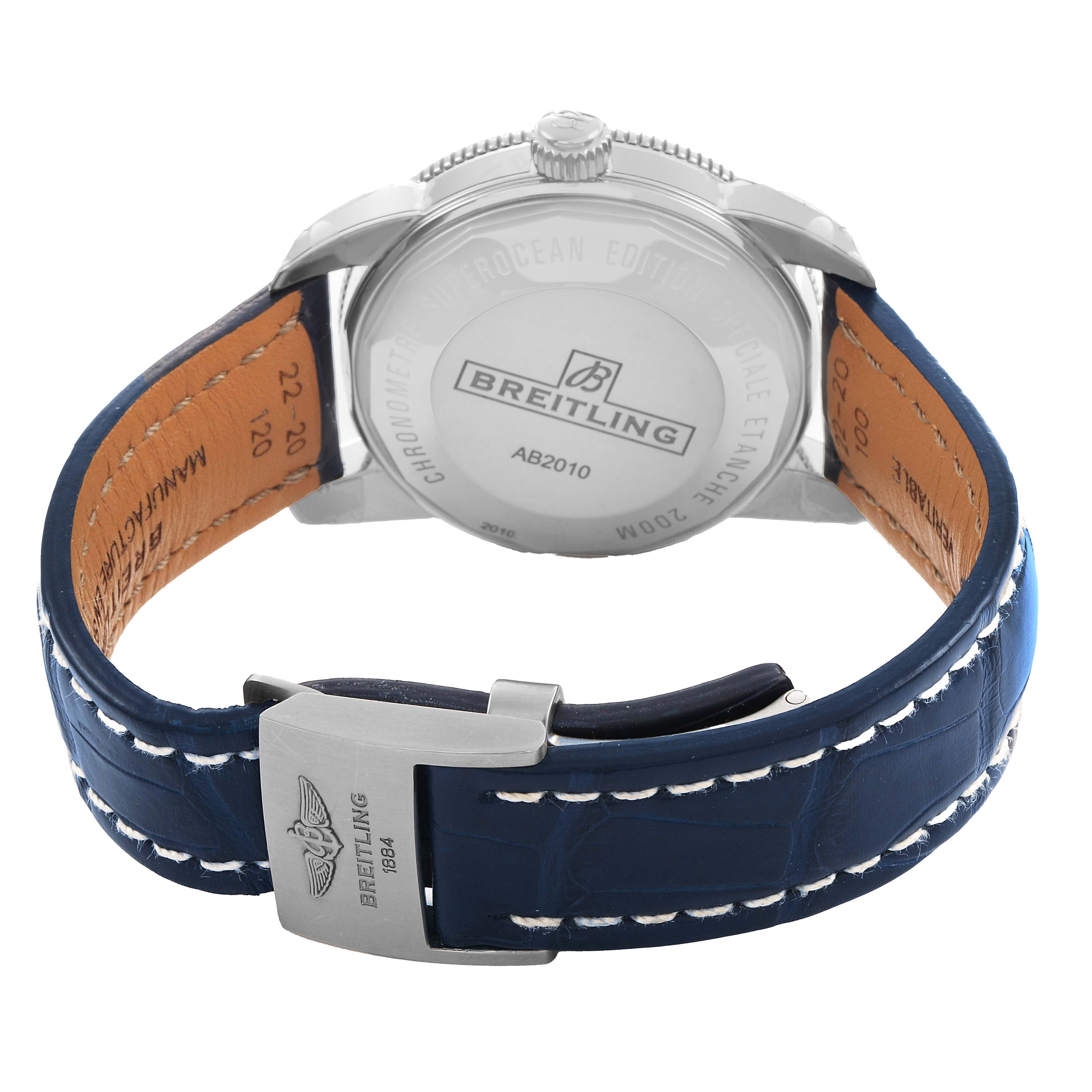 The Breitling Superocean A17321 Men's Stainless Steel Blue Dial watch is shown from the back, highlighting the case back, blue leather strap, and the clasp.