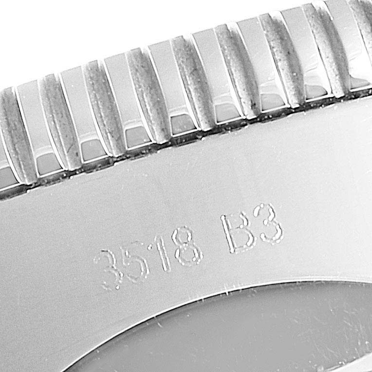 The image shows a close-up of the bezel edge and engraved serial number of a Breitling Superocean AB2010161C1A1 Men
s Stainless Steel Black Dial AB2010161C1A1 Men
s Stainless Steel Black Dial watch.