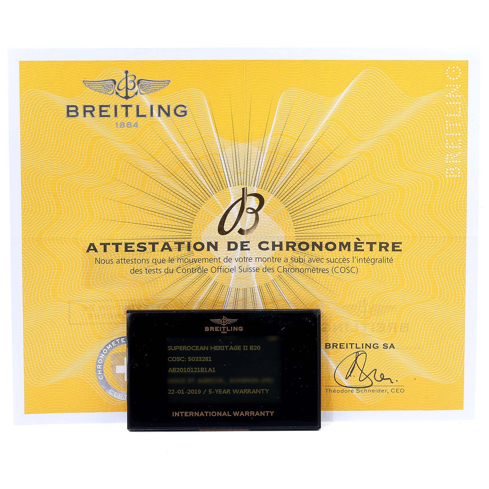 The image shows a Breitling Superocean AB2010161C1A1 Men
s Stainless Steel Black Dial AB2010161C1A1 Men
s Stainless Steel Black Dial model
s certificate of chronometer and international warranty card.
