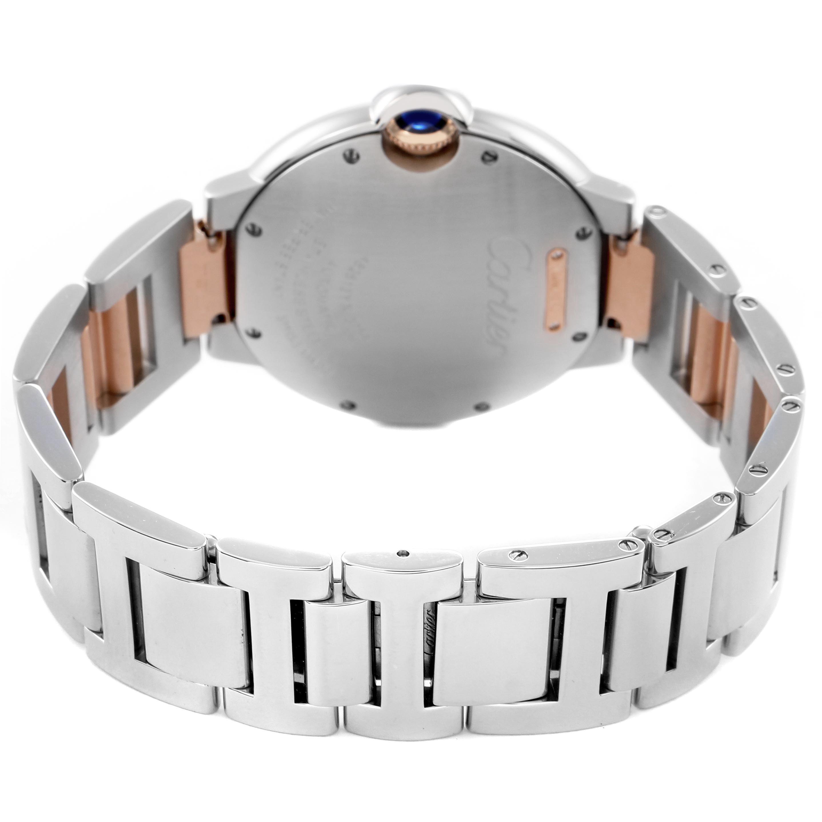 The image shows the back of the Cartier Ballon Bleu W2BB0003 Men's Steel and Gold (two tone) Silver Dial watch, highlighting the bracelet, case back, and crown with a blue cabochon.