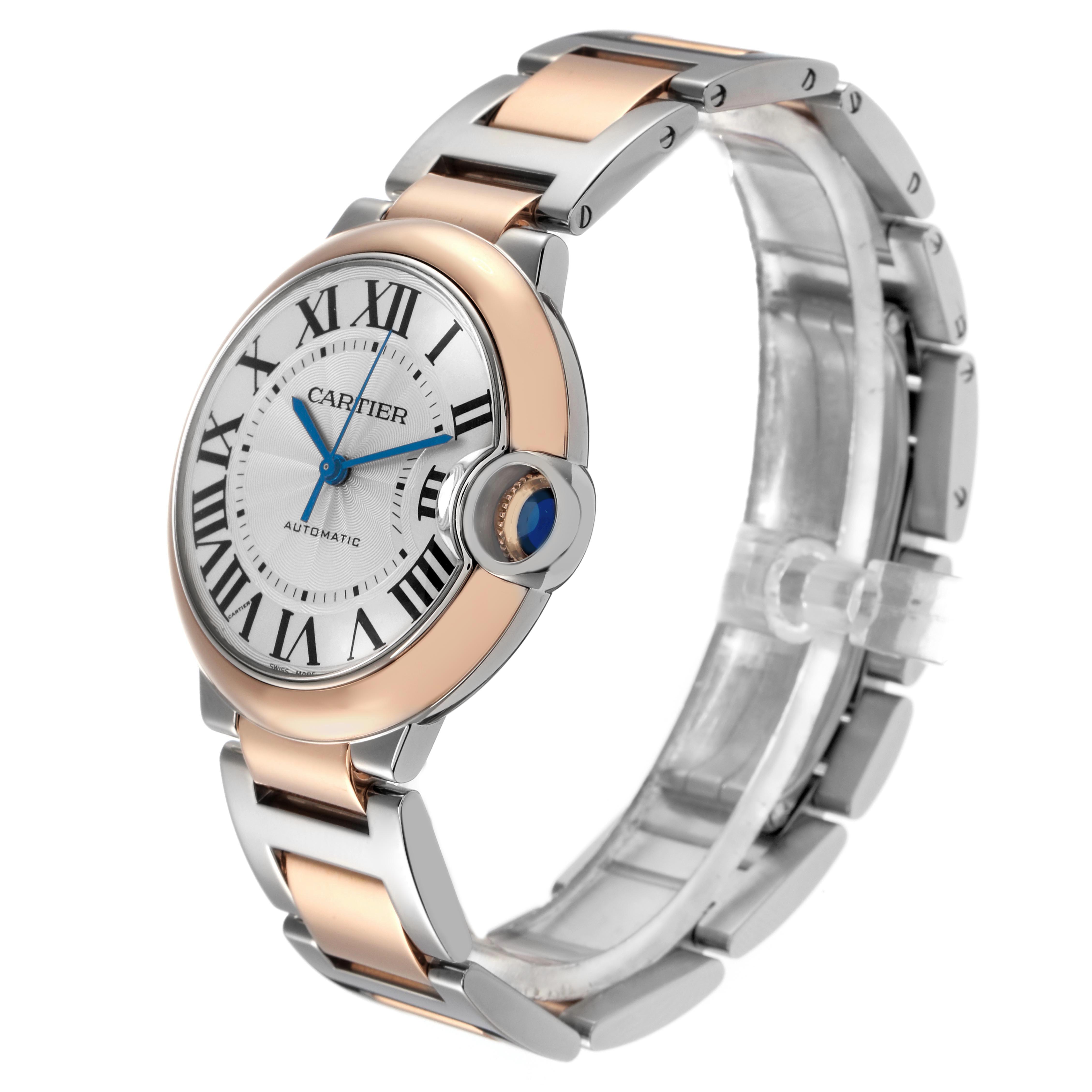 The Cartier Ballon Bleu W2BB0003 Men's Steel and Gold (two tone) Silver Dial watch is shown from a three-quarter angle, highlighting the face, side profile, and bracelet.
