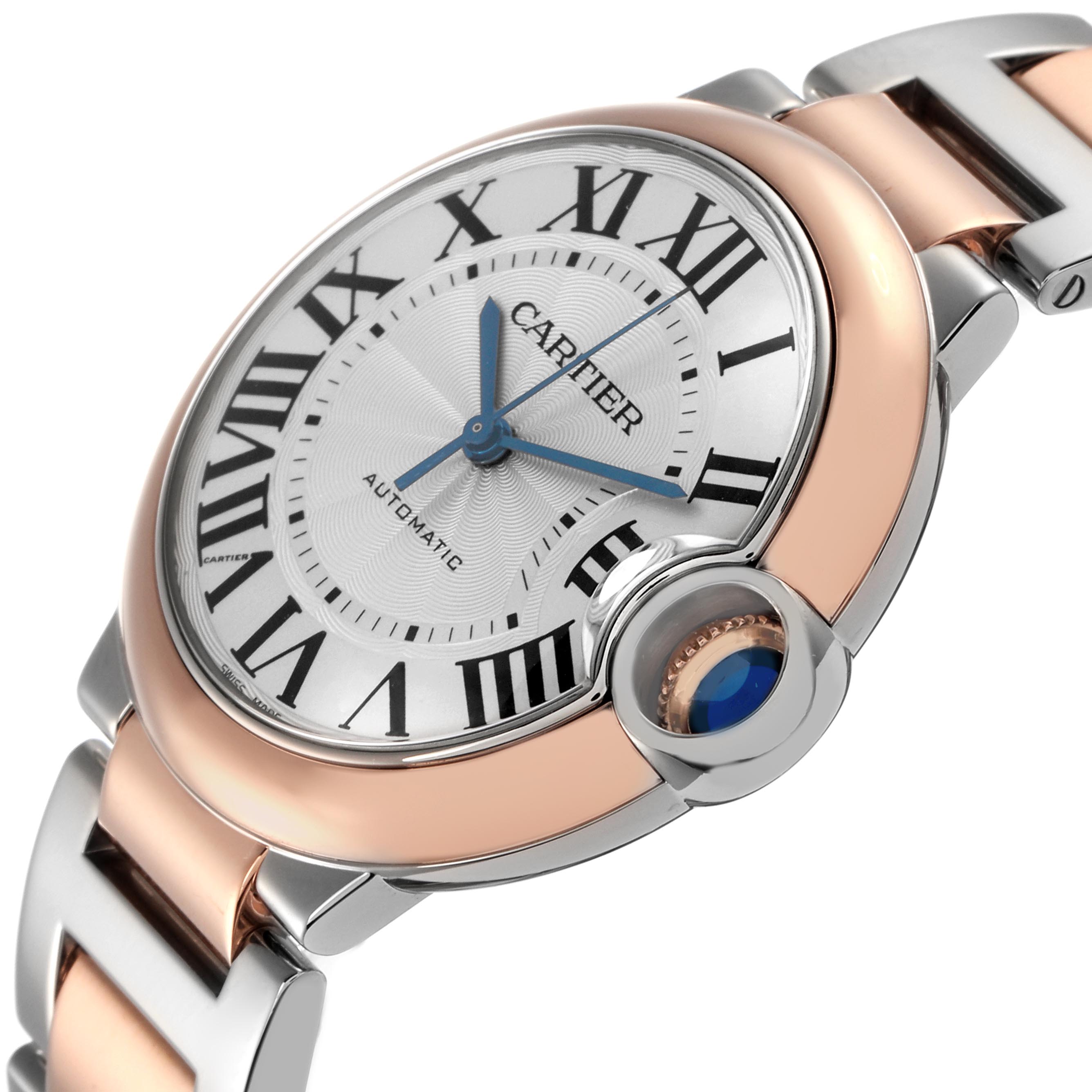 The Cartier Ballon Bleu W2BB0003 Men
s Steel and Gold (two tone) Silver Dial W2BB0003 Men
s Steel and Gold (two tone) Silver Dial watch is shown at an angle highlighting its dial, crown, and two-tone bracelet.