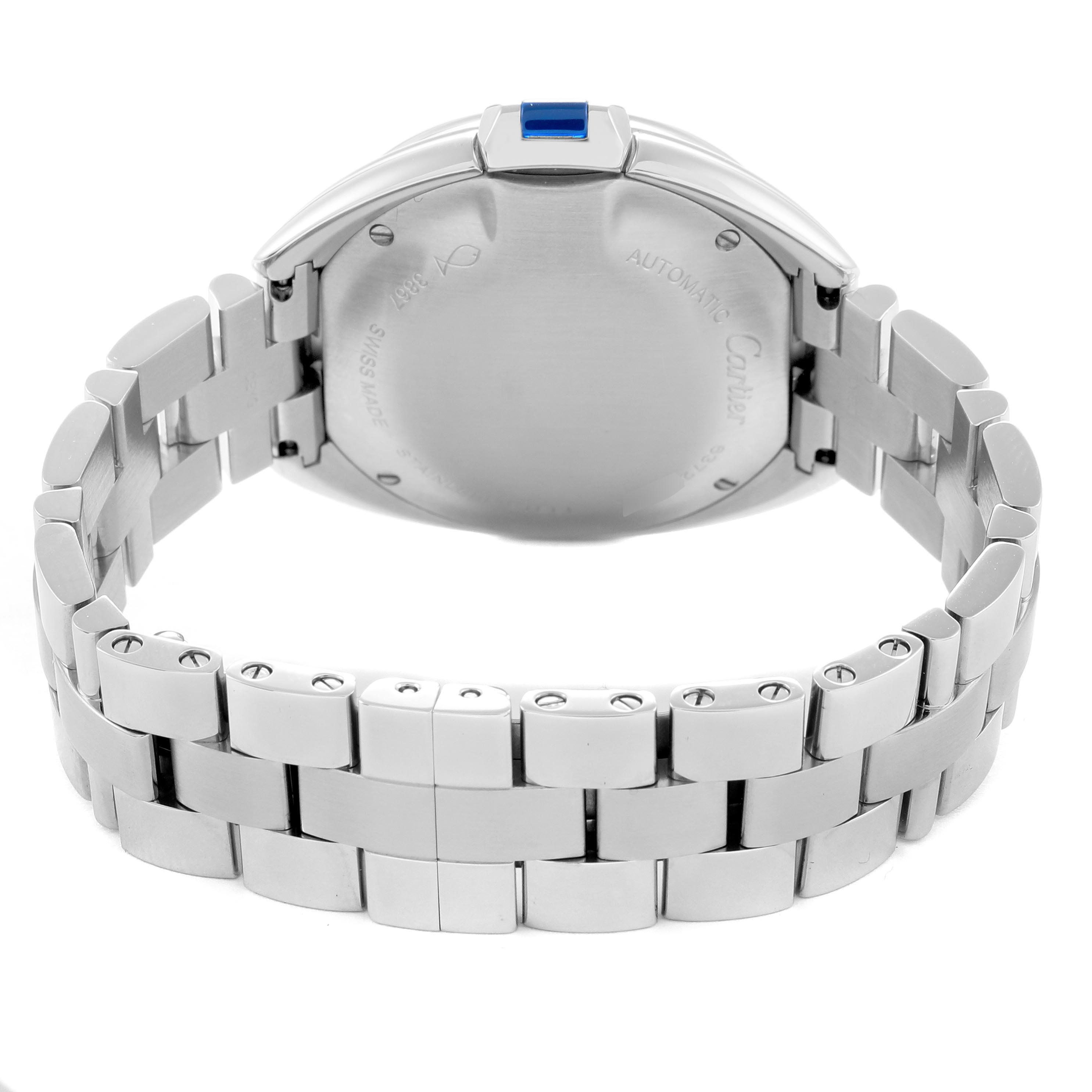The Cartier Clé watch is shown from the back angle, highlighting the case and bracelet.