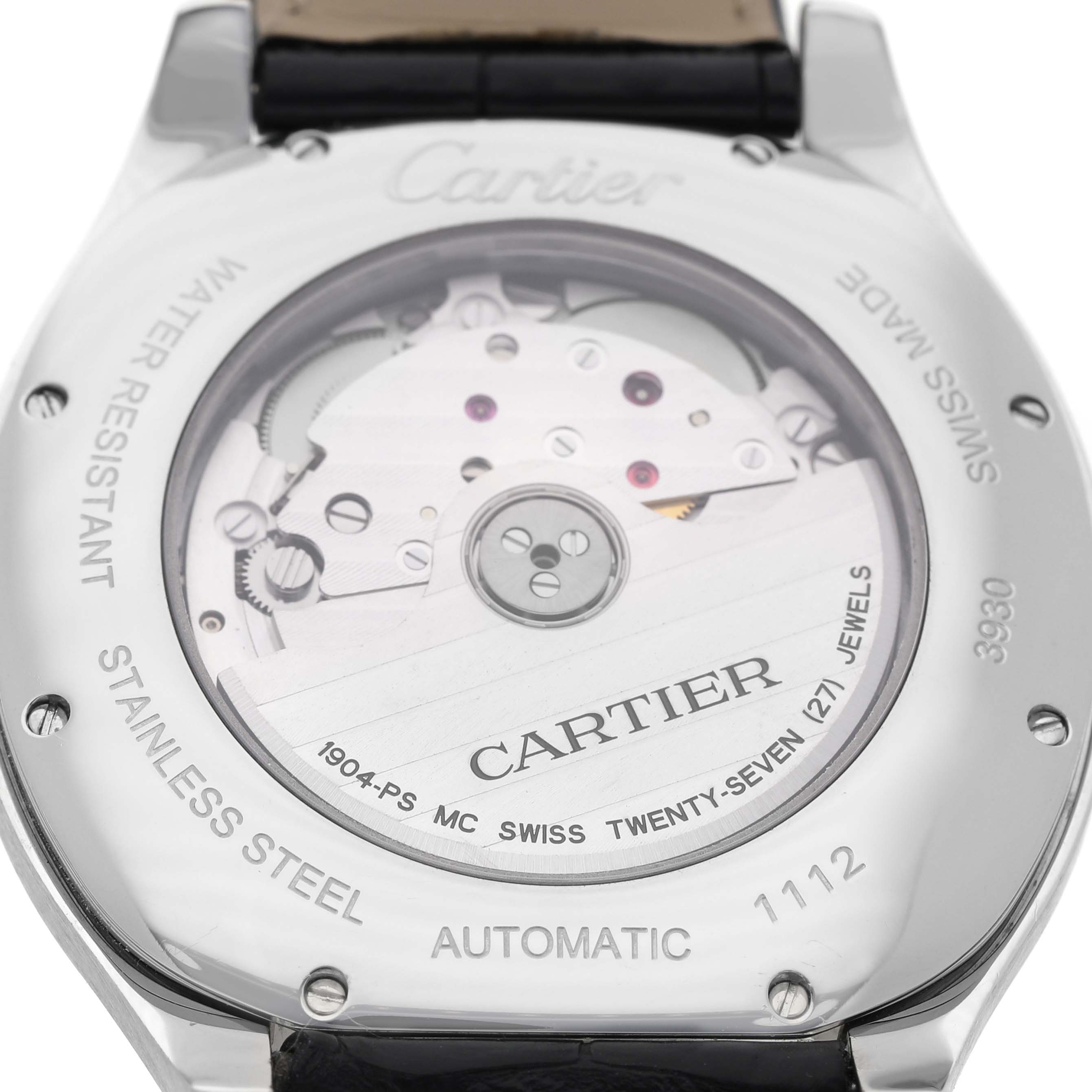The image shows the back of a Drive de Cartier watch, highlighting its automatic movement and stainless steel case.