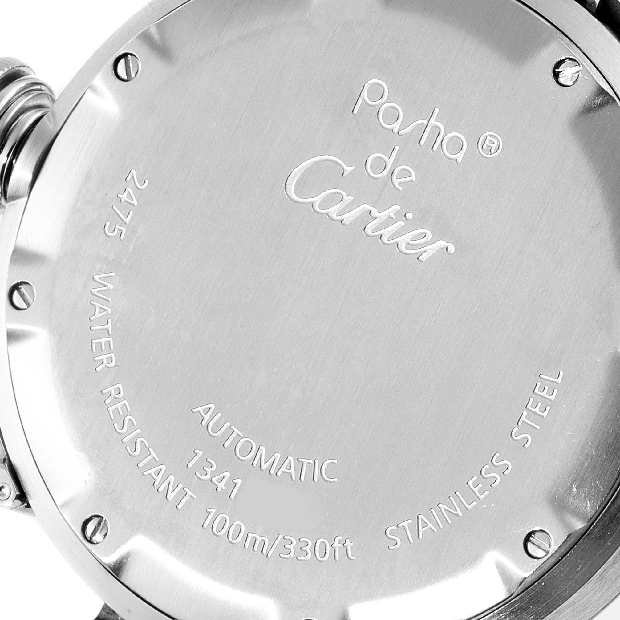 The image shows the back of a Pasha de Cartier watch, displaying model information and water resistance details.
