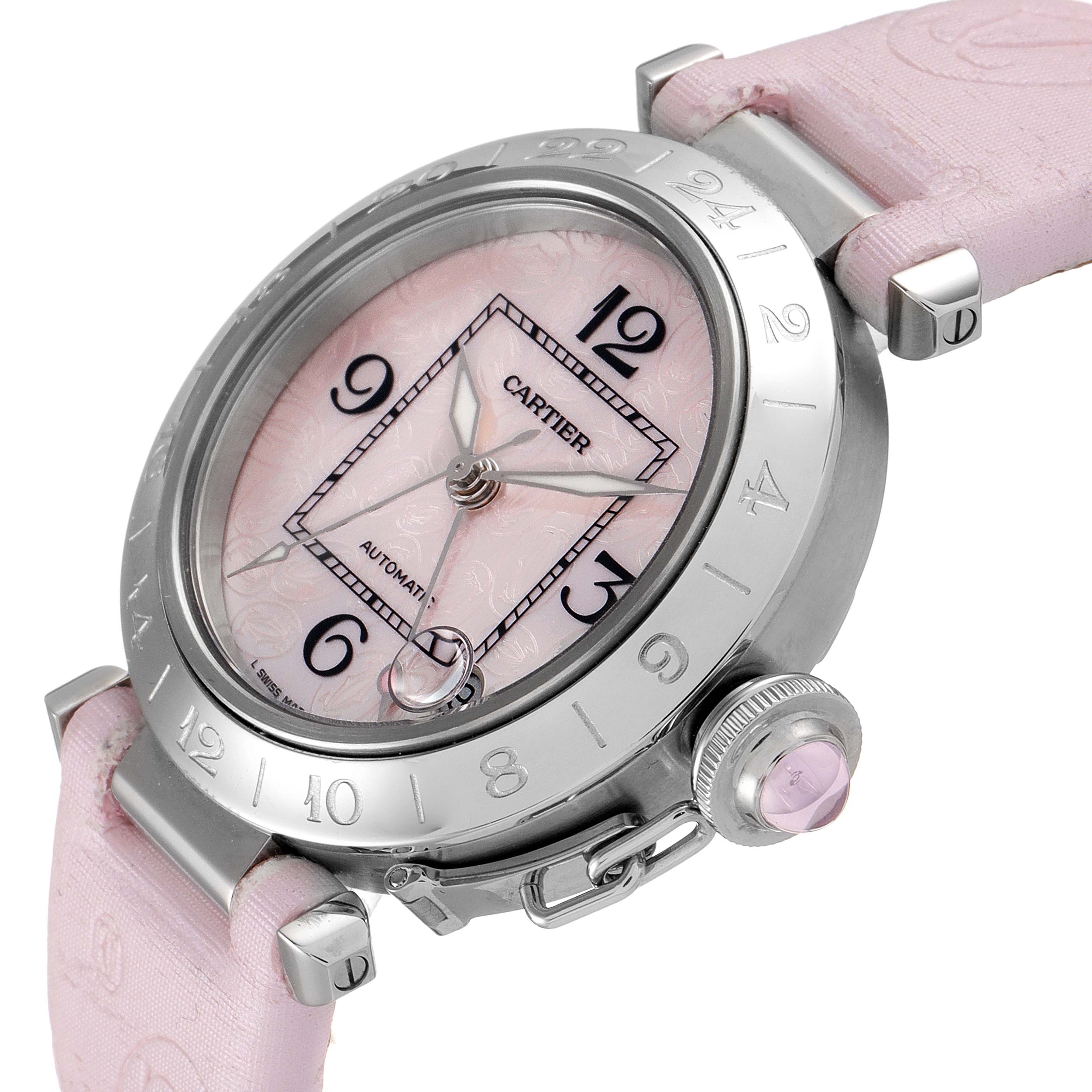 The Cartier Pasha W3107099 Women's Stainless Steel Mother of Pearl Dial W3107099 Women's Stainless Steel Mother of Pearl Dial watch is shown from an angled close-up, featuring its pink dial, case, bezel, and strap details.