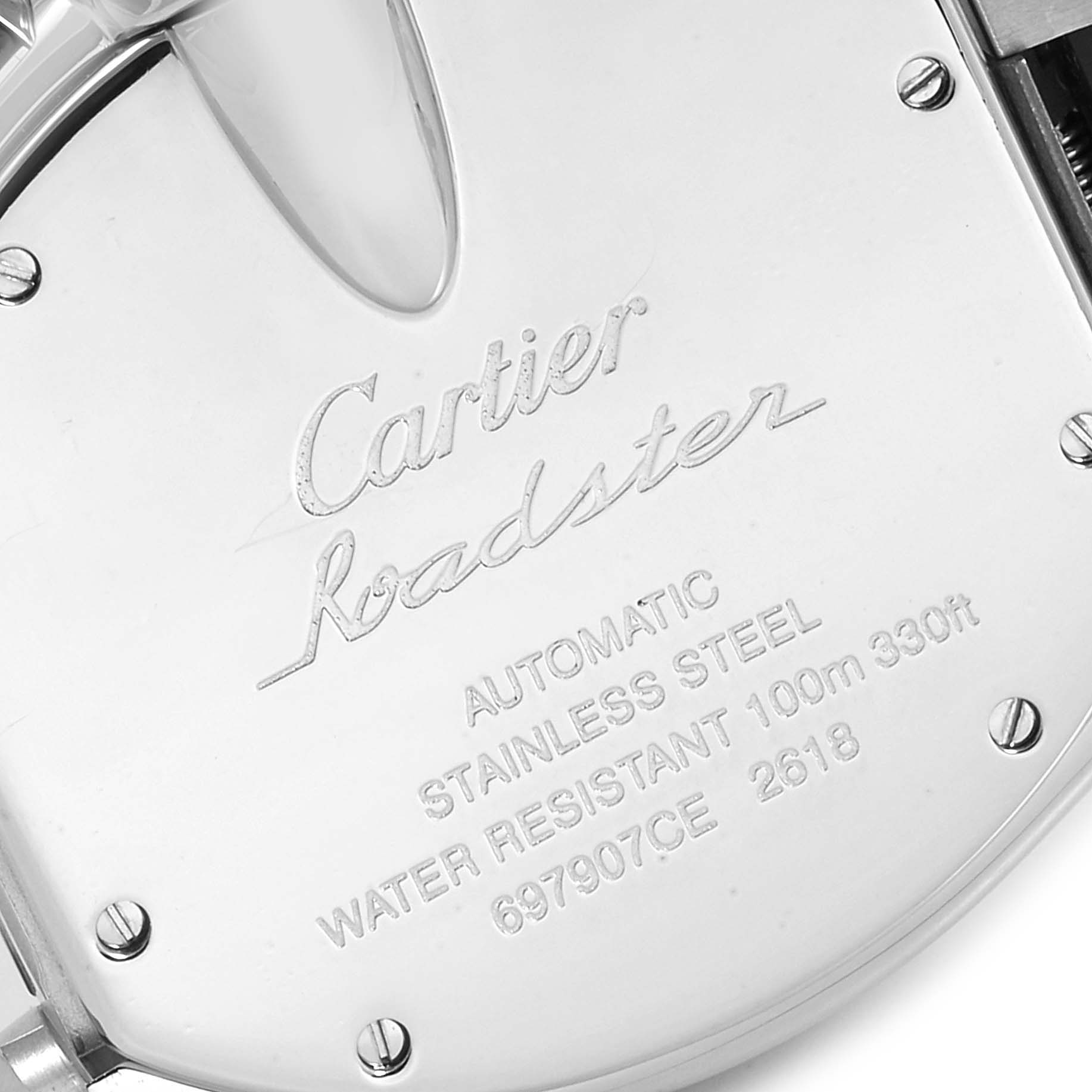 The image shows a close-up of the back case of a Cartier Roadster W62019X6 Men
s Stainless Steel Silver Dial W62019X6 Men
s Stainless Steel Silver Dial watch, highlighting its engravings and screws.