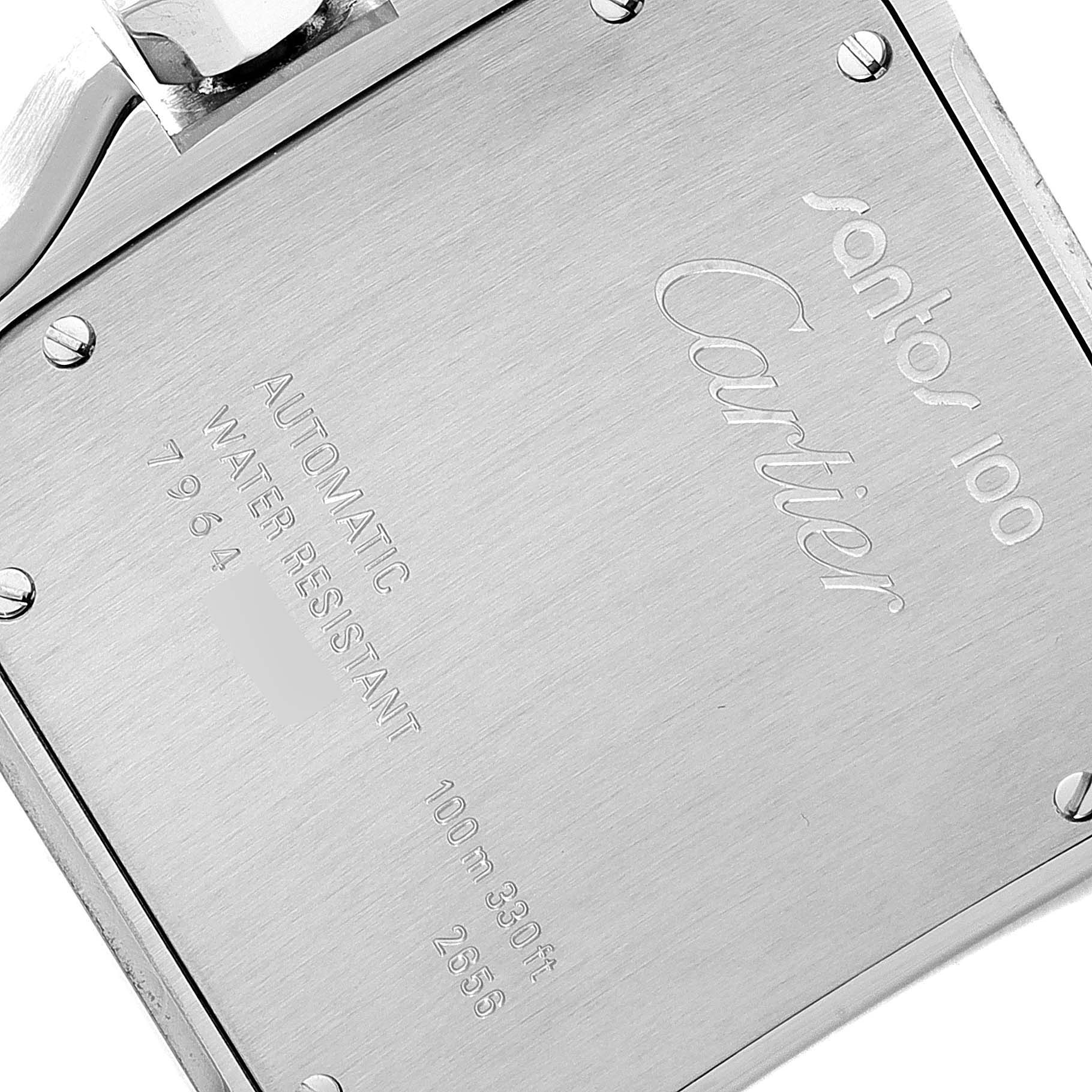 The image shows the back case of a Santos 100 model by Cartier, displaying engravings and screws.
