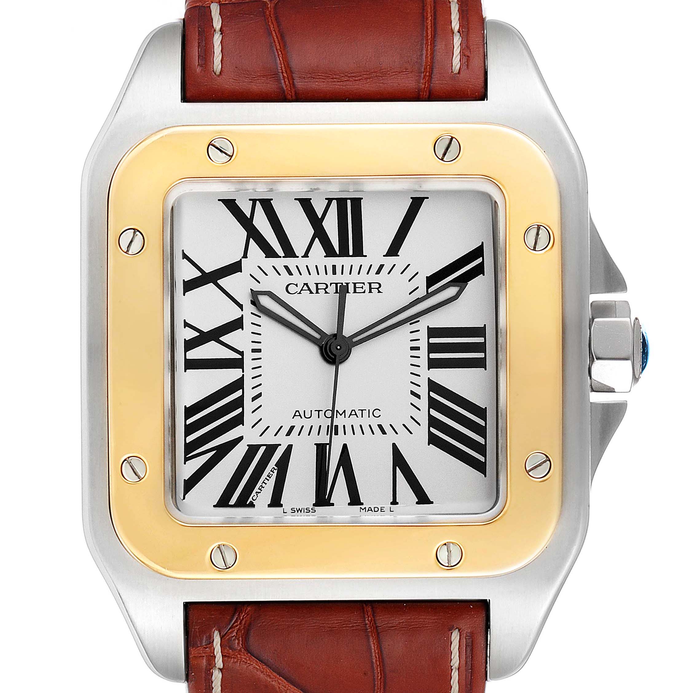 The image shows a Cartier Santos W20072X7 Men
s Steel and Gold (two tone) Silver Dial W20072X7 Men
s Steel and Gold (two tone) Silver Dial watch face and bezel, highlighting its Roman numerals and brown leather strap.