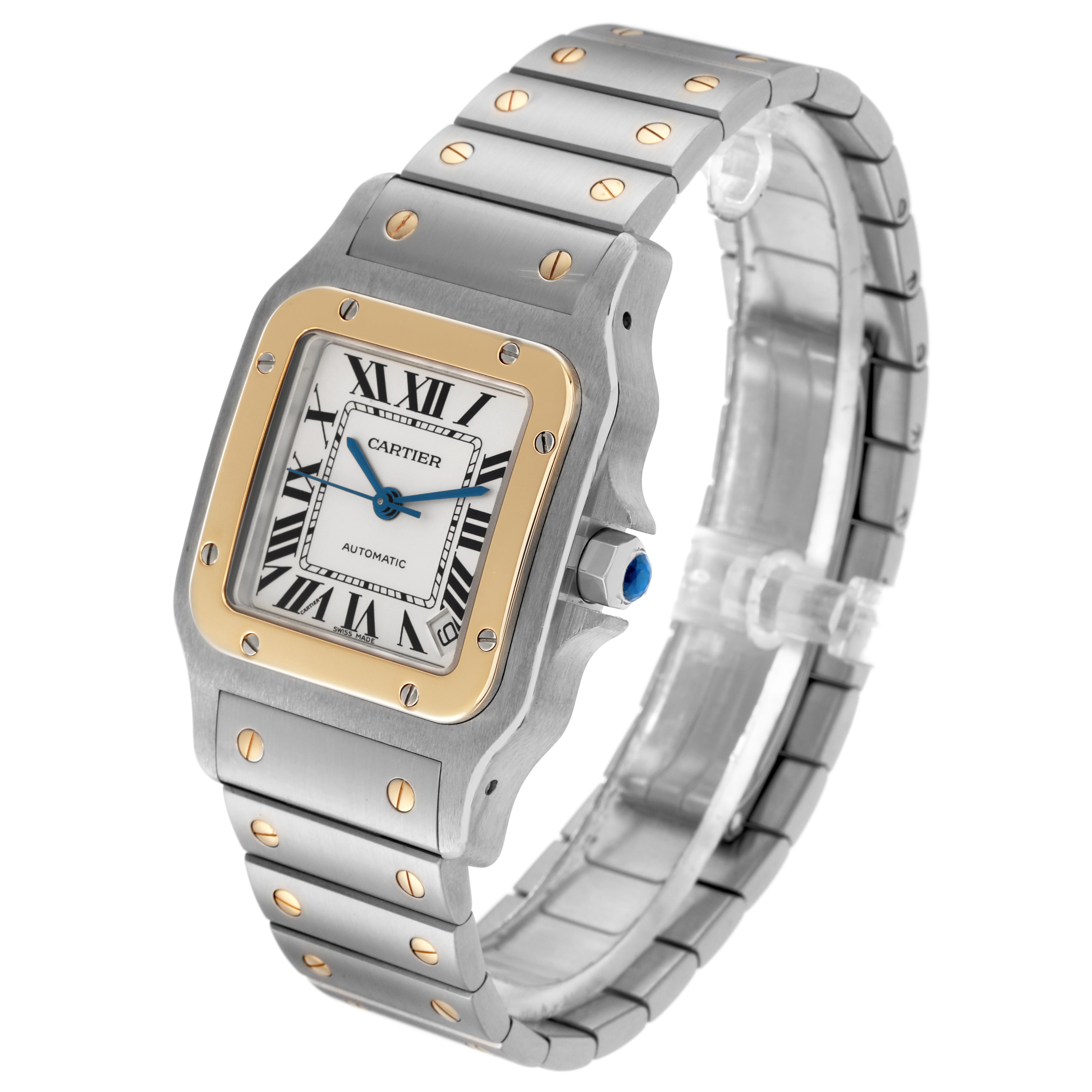 The Cartier Santos W20099C4 Men
s Steel and Gold (two tone) Silver Dial W20099C4 Men
s Steel and Gold (two tone) Silver Dial watch is shown at a three-quarter angle, highlighting the face, bezel, and bracelet.
